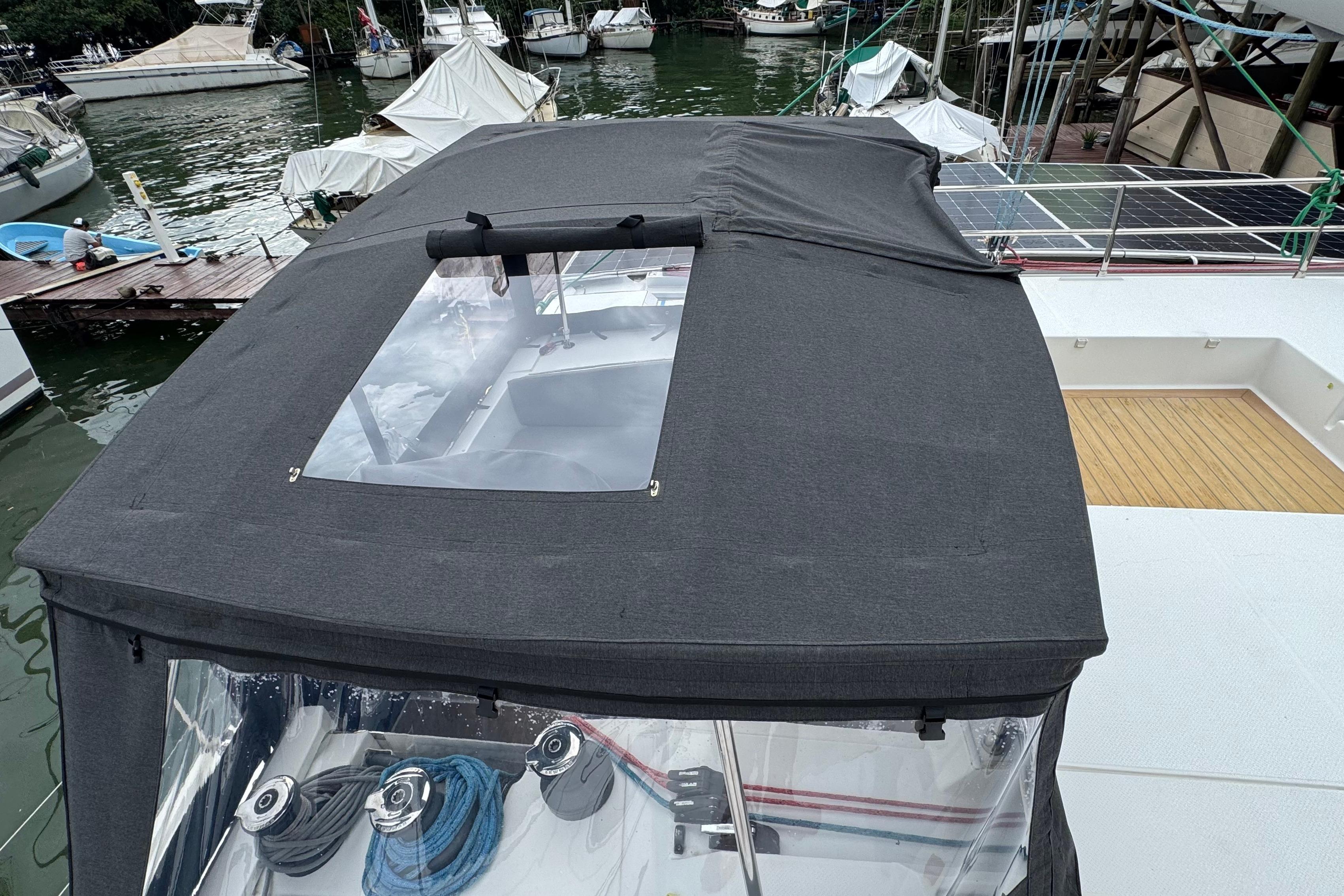 2020 Fountaine Pajot Saona 47 catamaran with covered cockpit and visible solar panels.