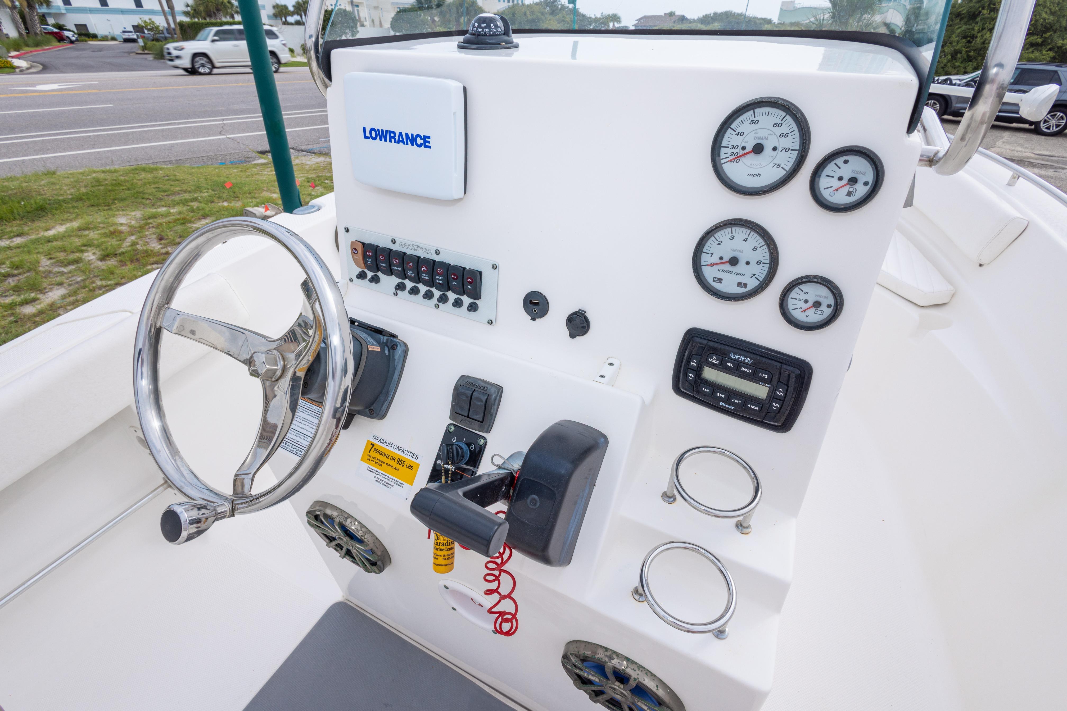 2014 Sea Fox 209 Commander boat dashboard with steering wheel and gauges.