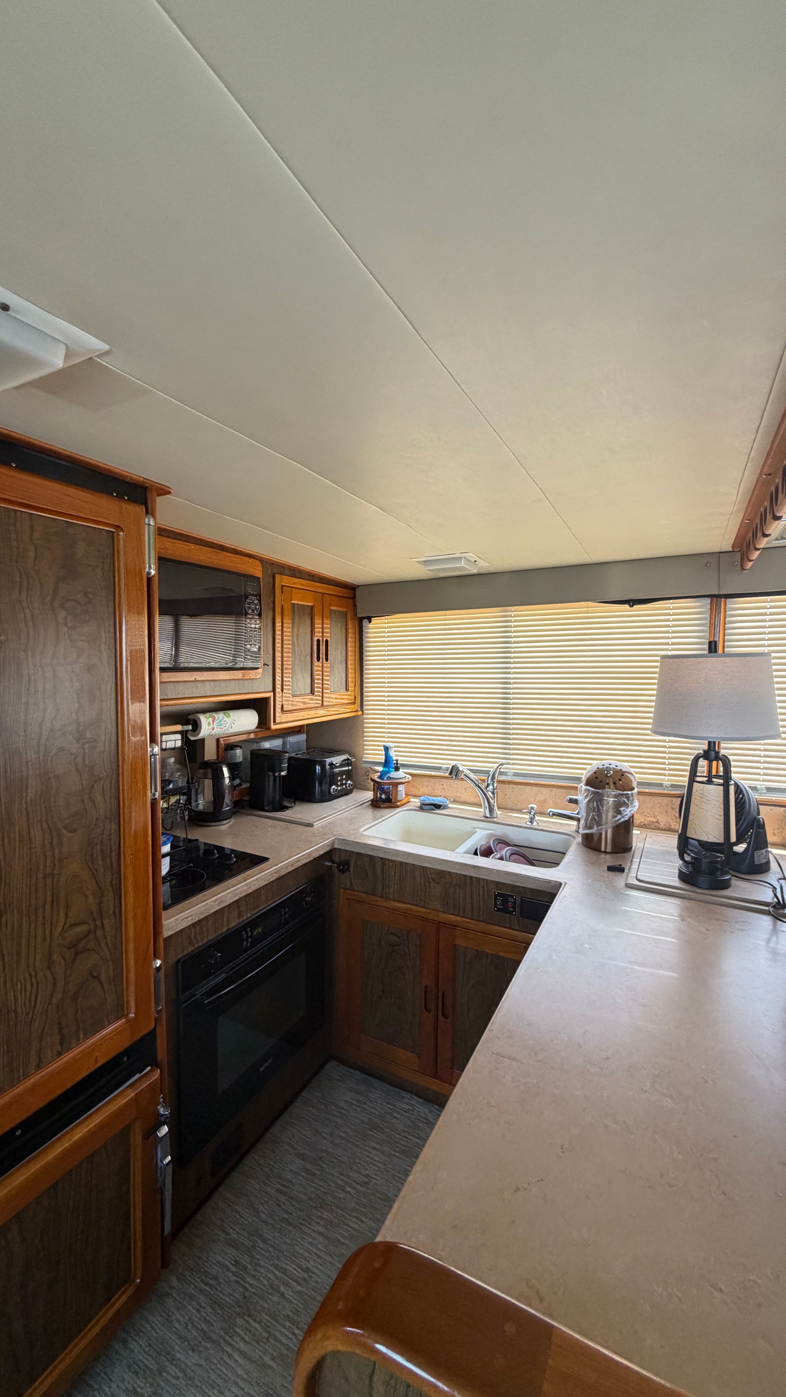 Interior of 1966 Drake Yachtfisher with modern kitchen.