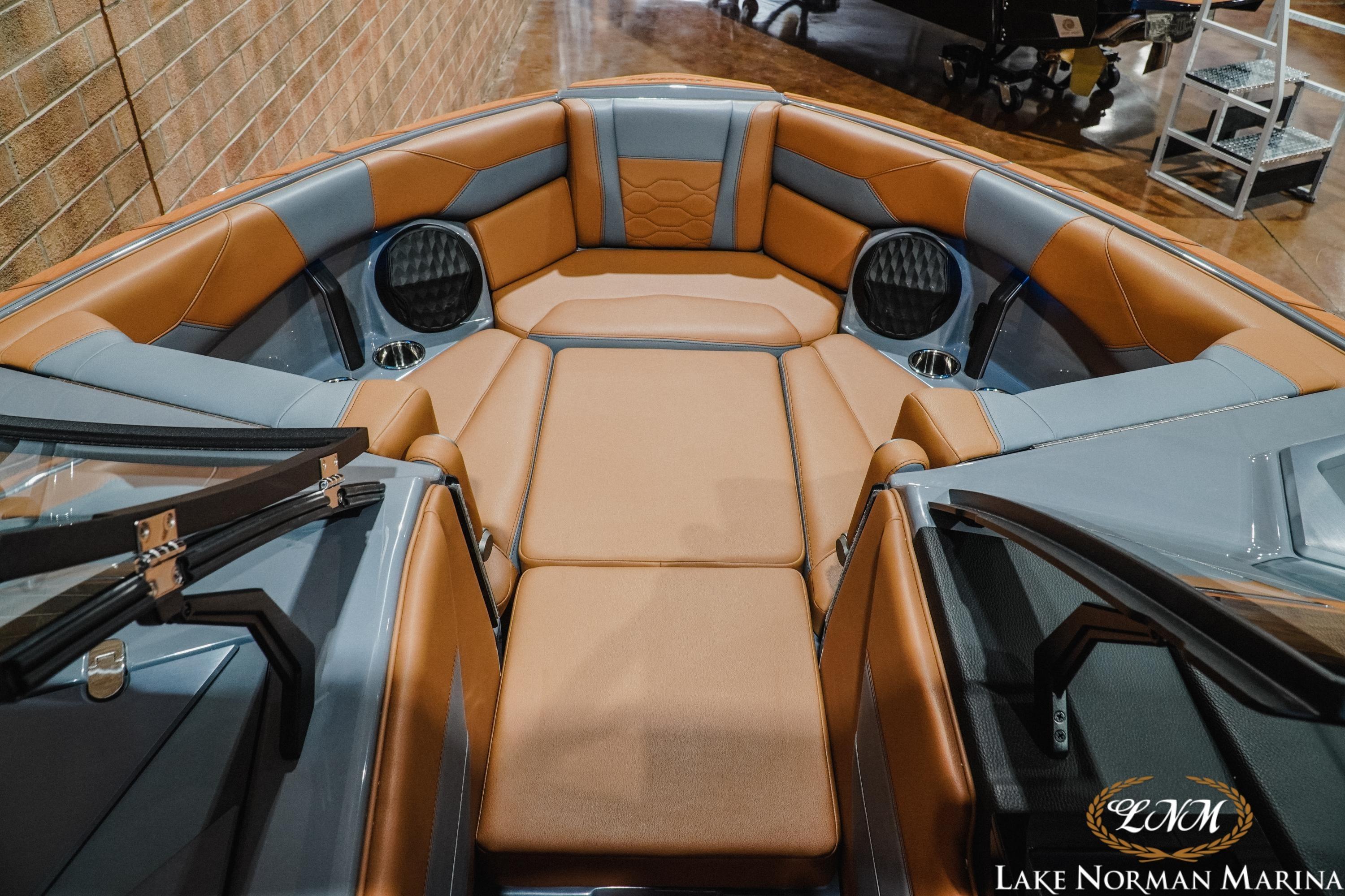Luxurious interior of 2026 Malibu Wakesetter 23 LSV boat with tan and gray seating.