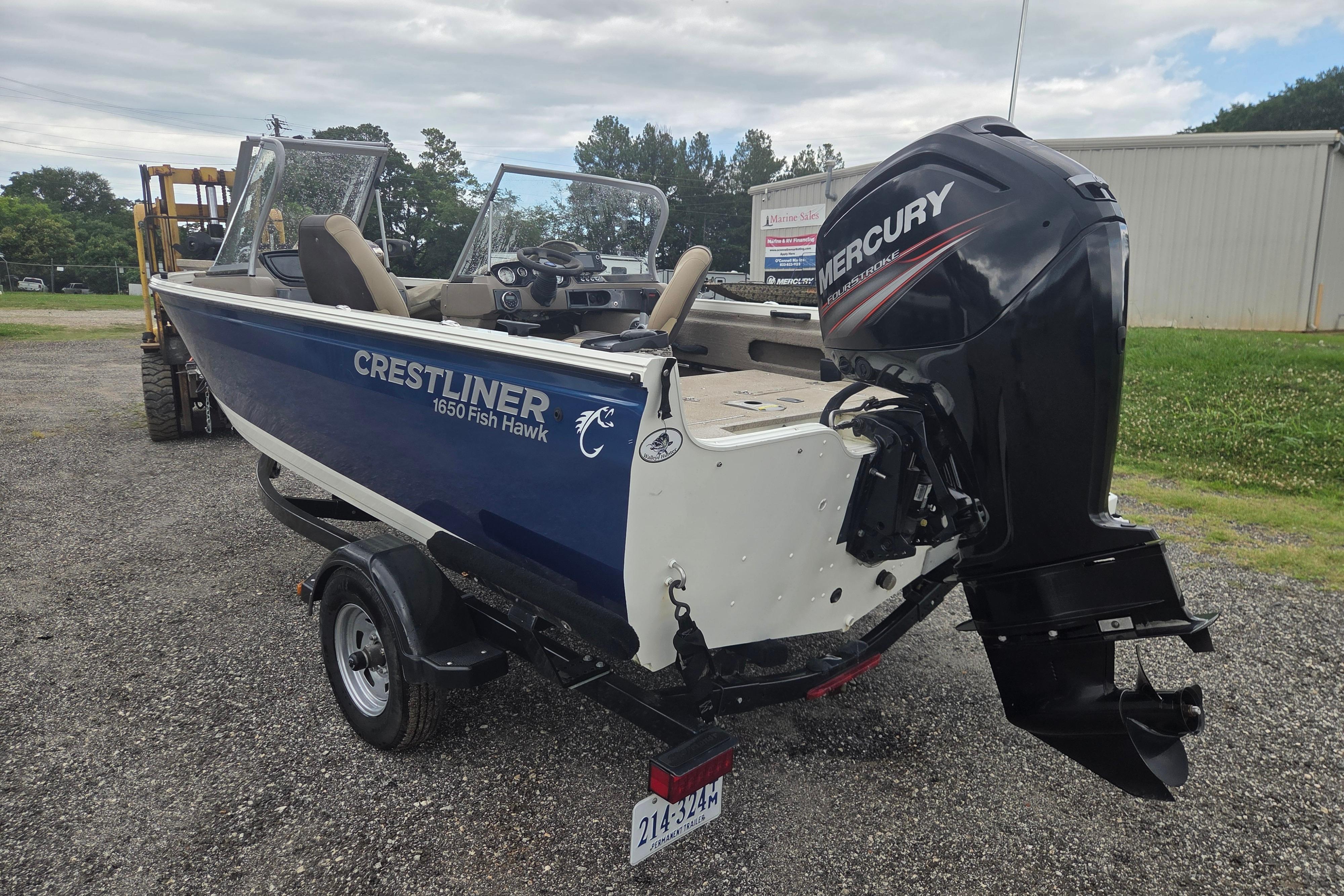 2016 Crestliner 1650 Fish Hawk SC boat with Mercury outboard motor on trailer.