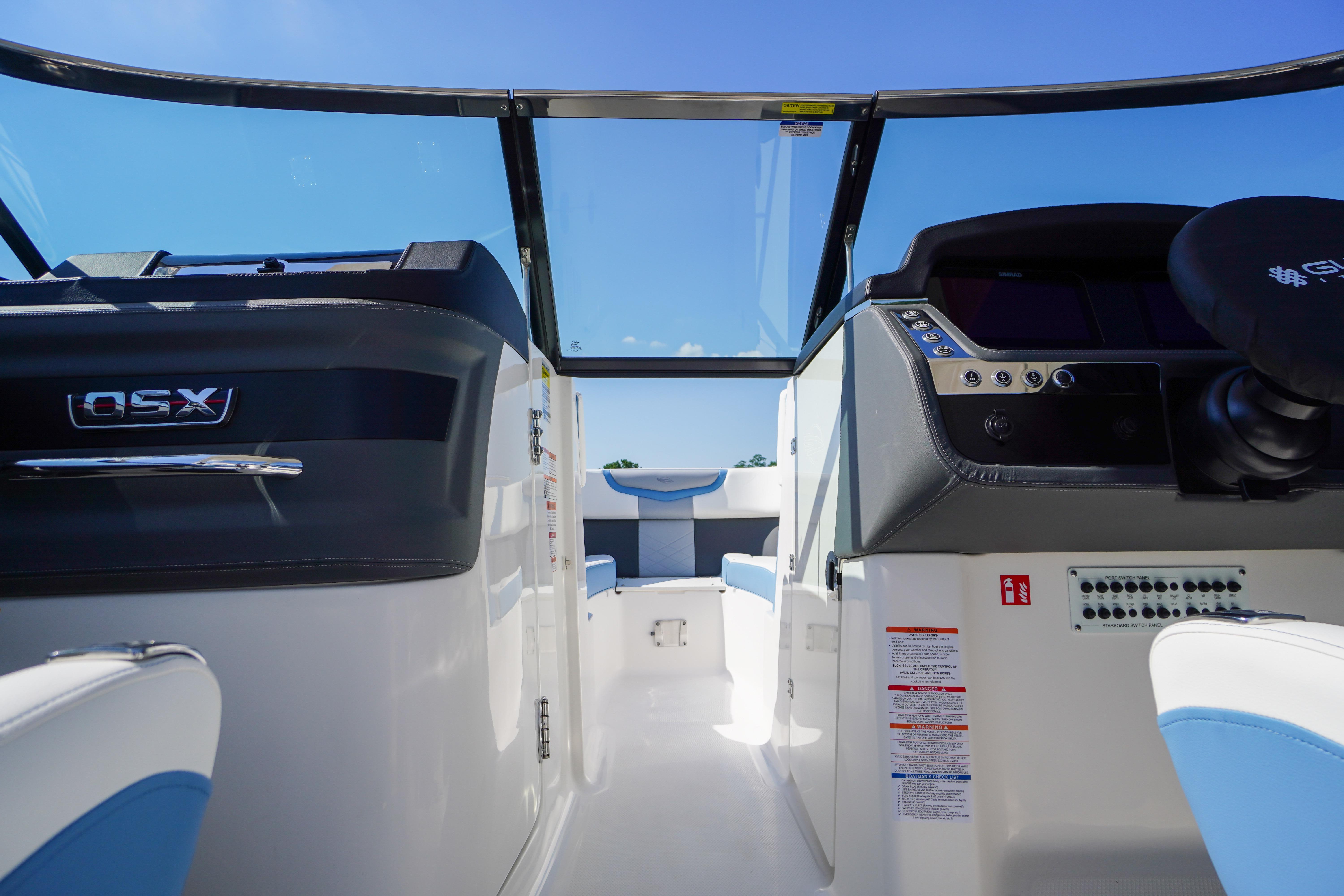 Interior view of 2026 Chaparral 270 OSX boat cockpit with modern controls and seating.