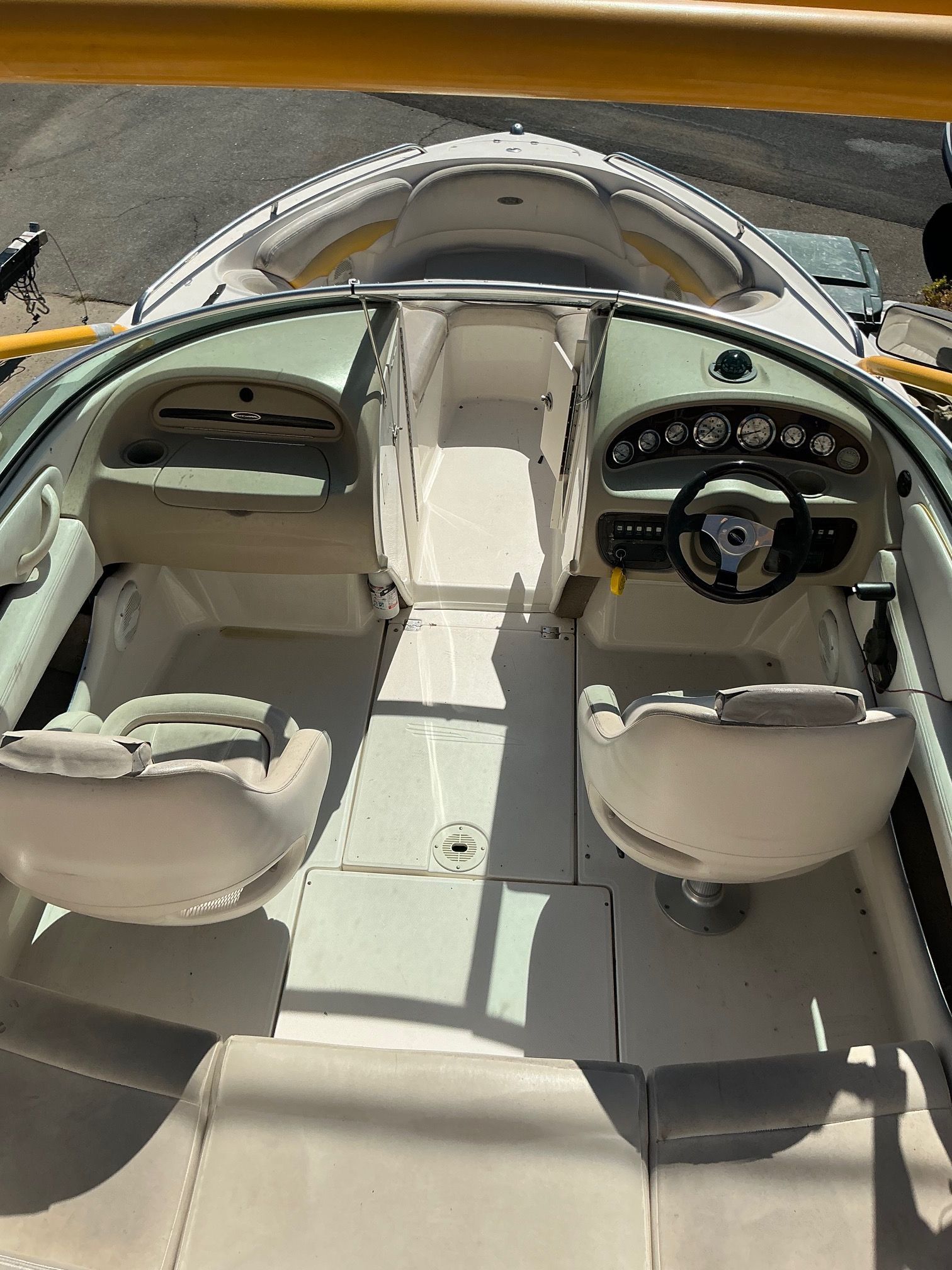 The image shows the cockpit of a 2003 Chaparral 210 SS with two seats and a helm station.