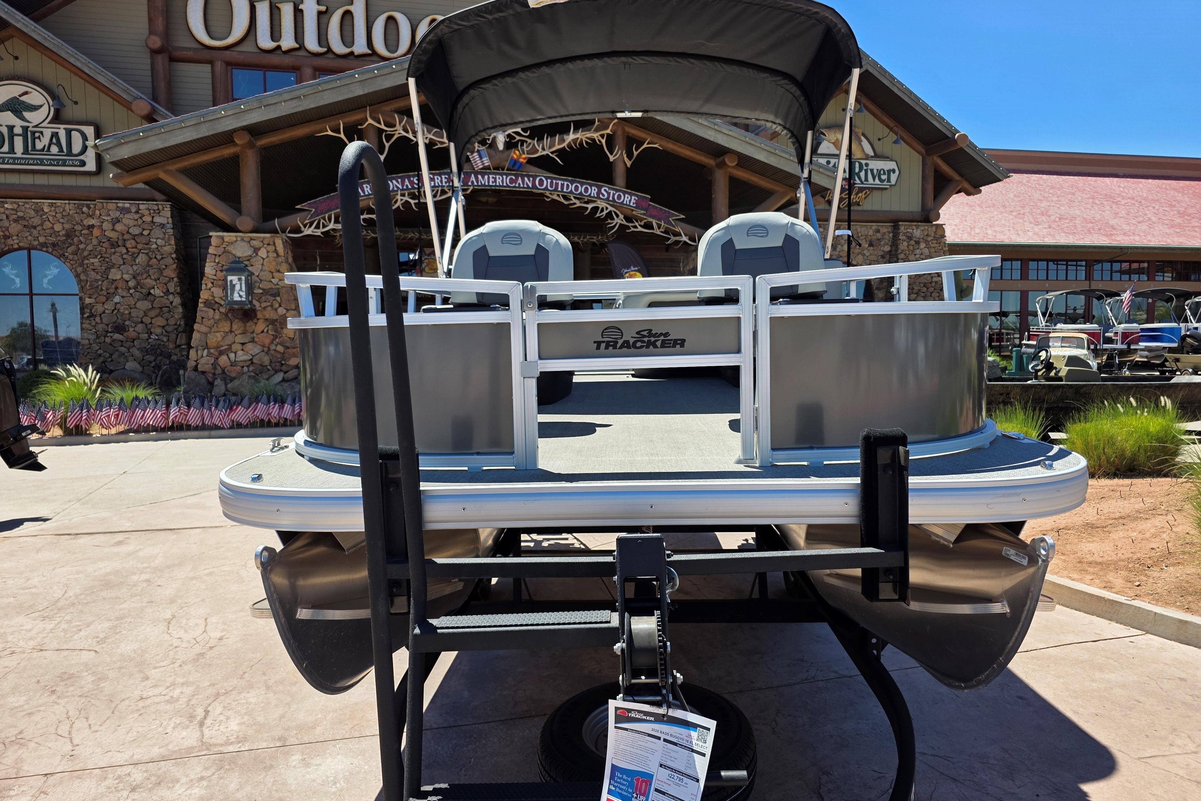2026 Sun Tracker Bass Buggy 16 XL Select pontoon boat displayed outdoors.