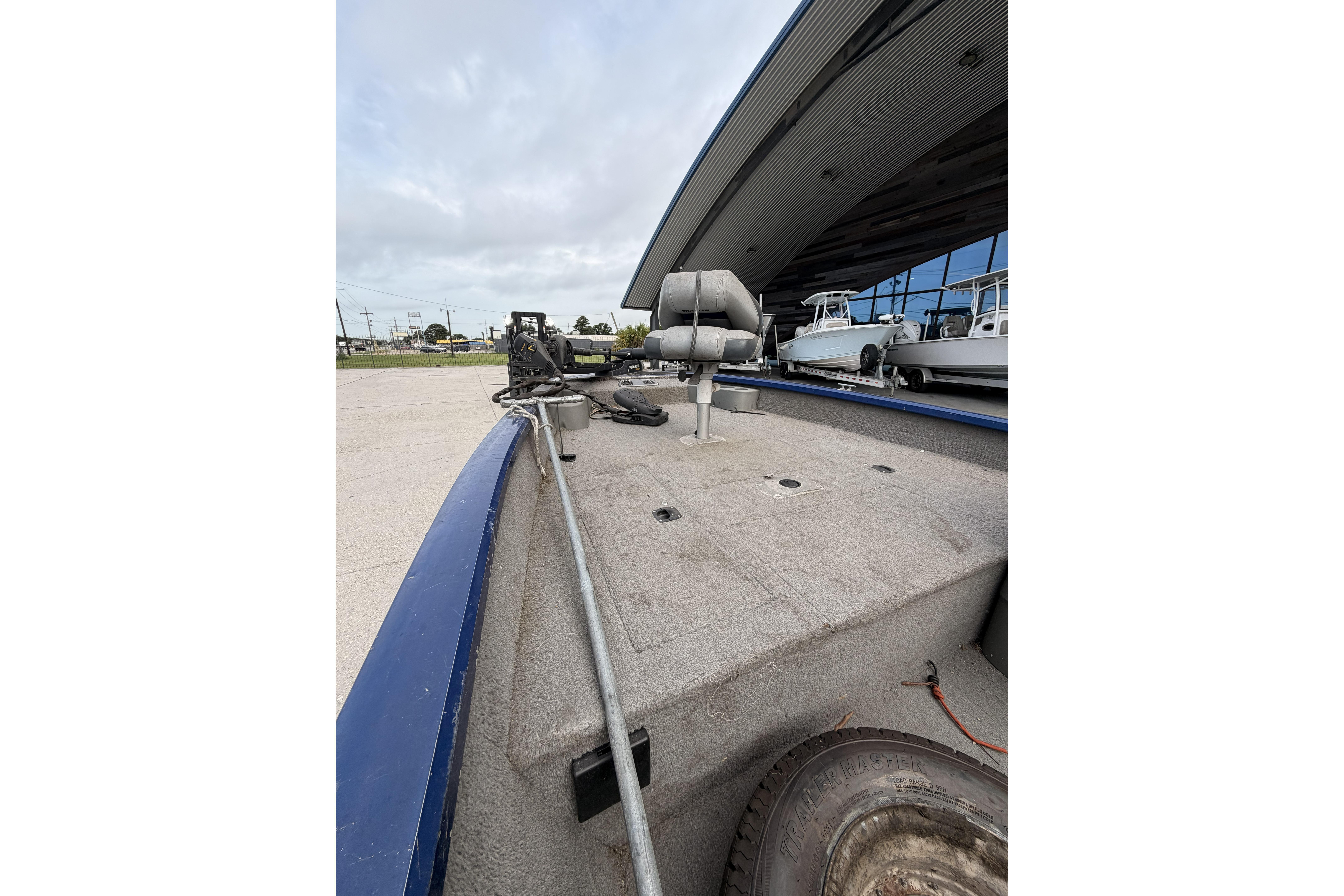 2012 Bass Tracker Pro 17 boat interior with fishing seat and equipment.