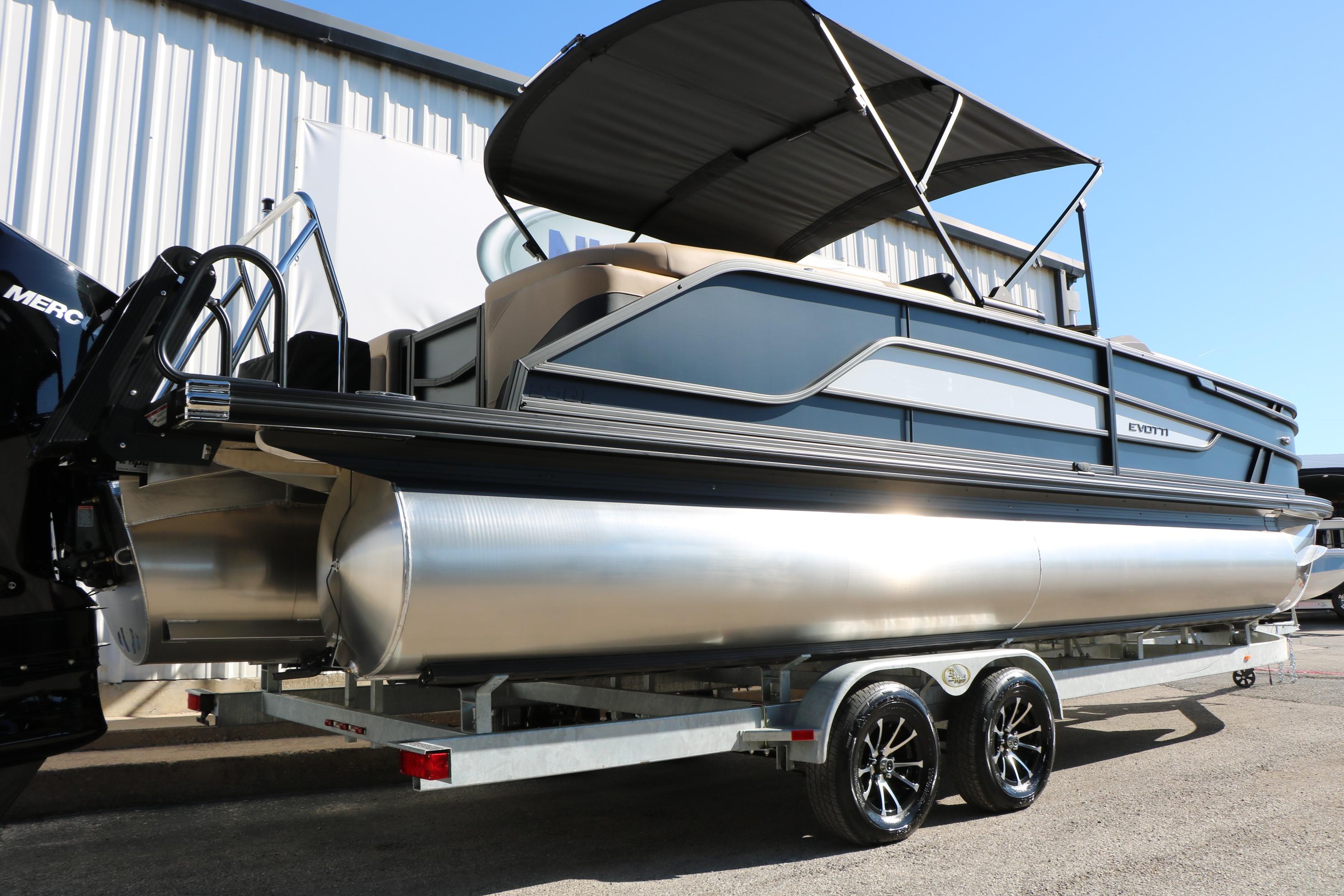 2026 Evotti 525 QL Tri-Toon boat on trailer, featuring sleek design and modern amenities.