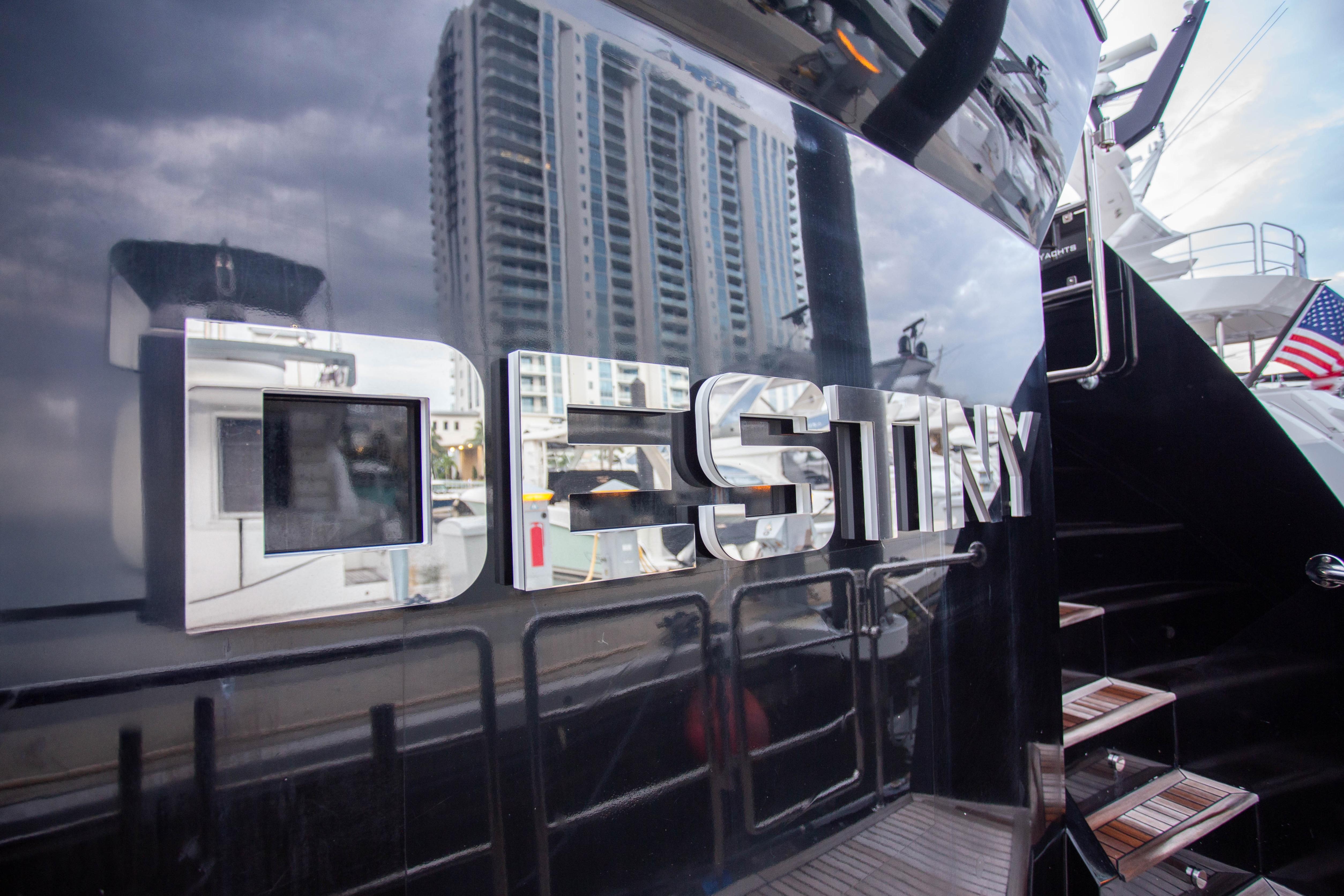 Fifth Ocean Yachts 24m Explorer Yacht 'Destiny' docked, reflecting cityscape, 2014 model.