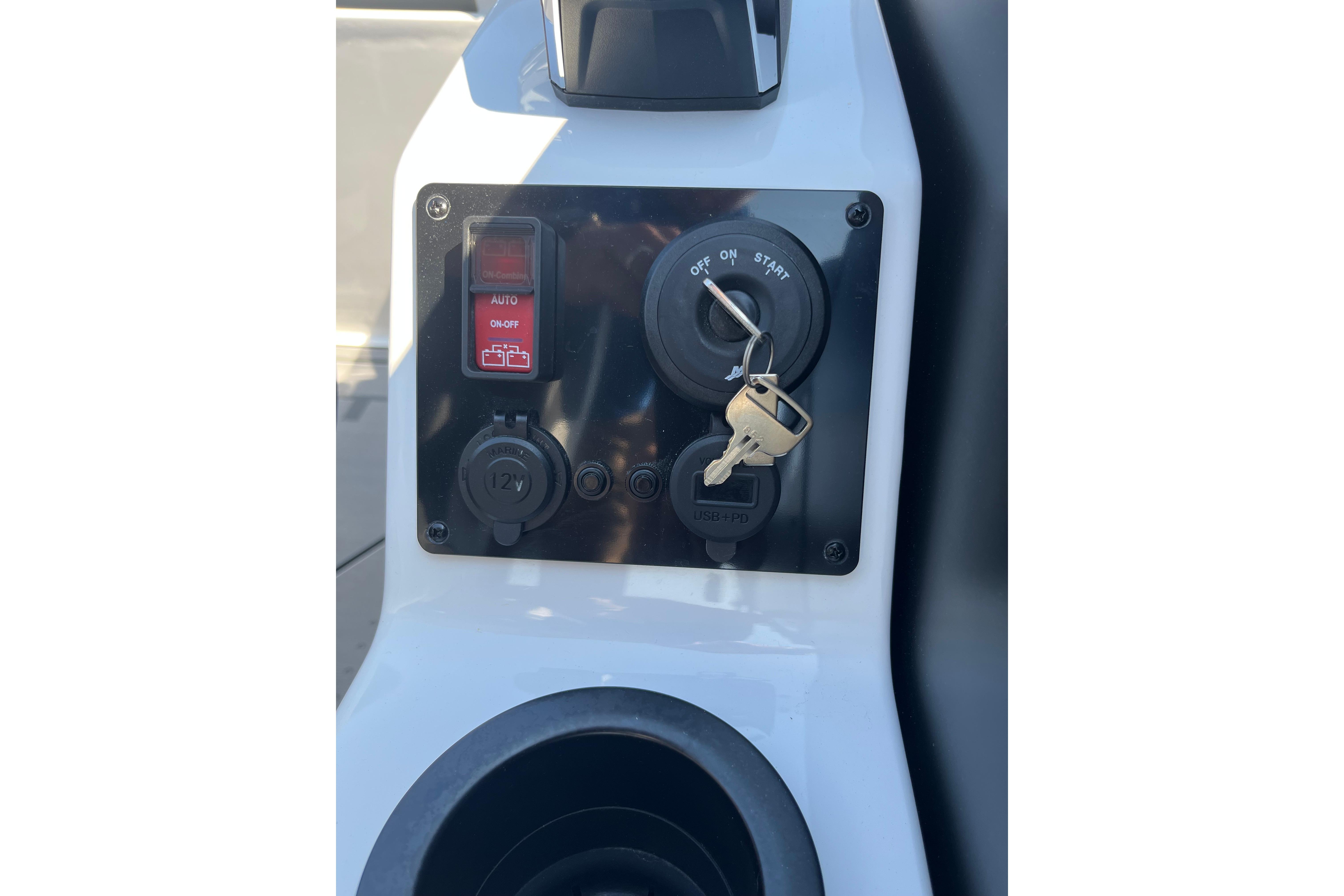Control panel of 2026 Evotti 725CS with ignition key and switches.