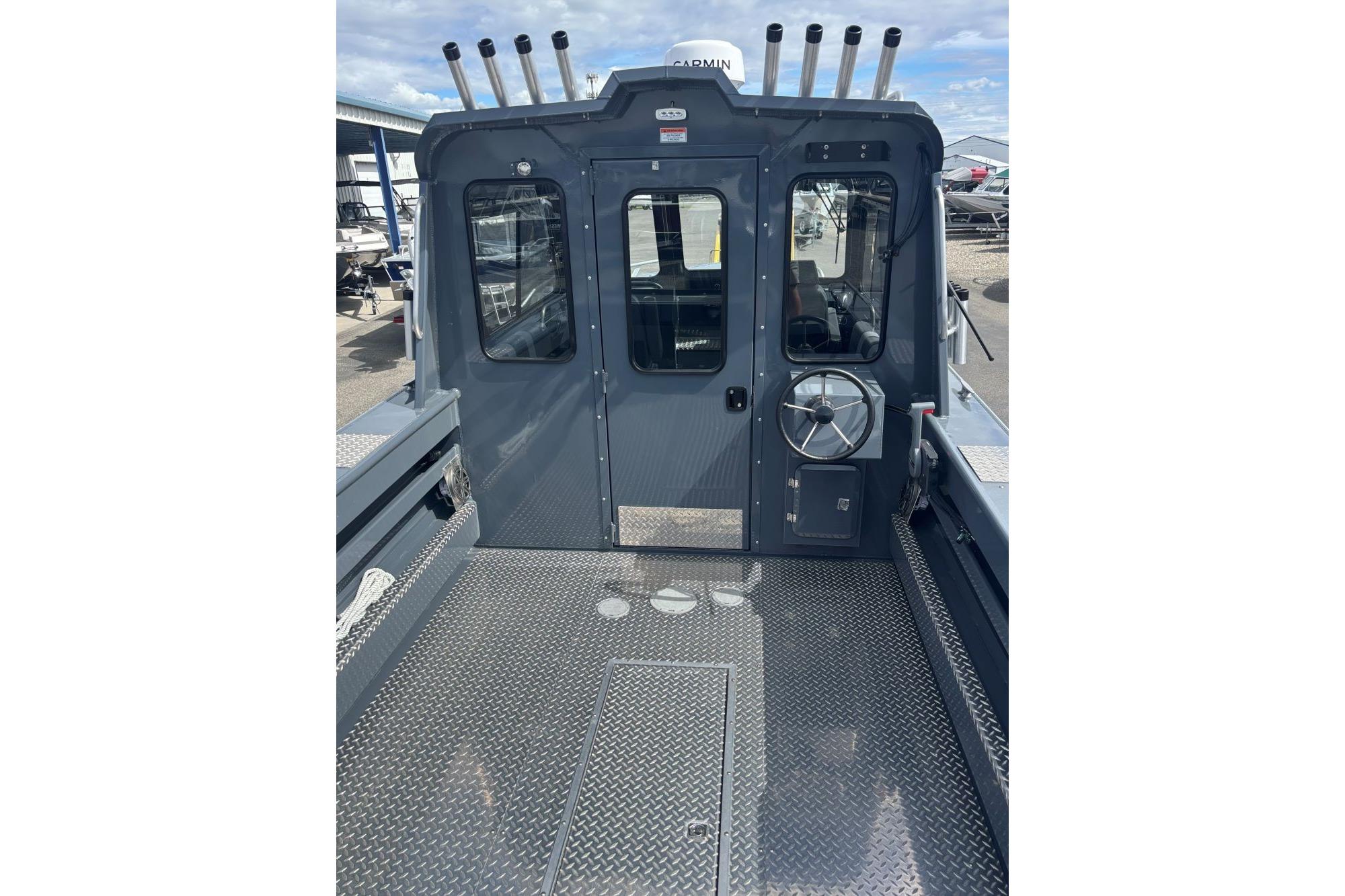 2024 Hewescraft 240 Ocean Pro Hardtop boat with metal deck and rod holders.