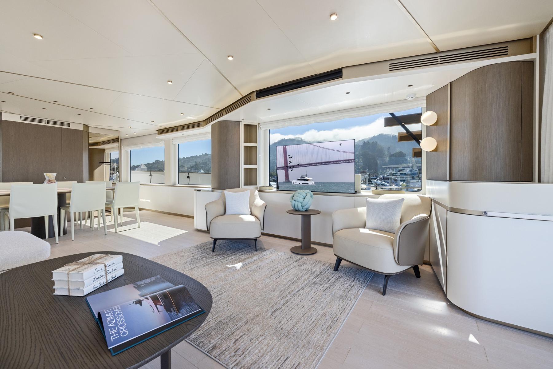 Luxurious interior of 2026 Azimut Magellano 25M yacht with elegant seating and scenic views.