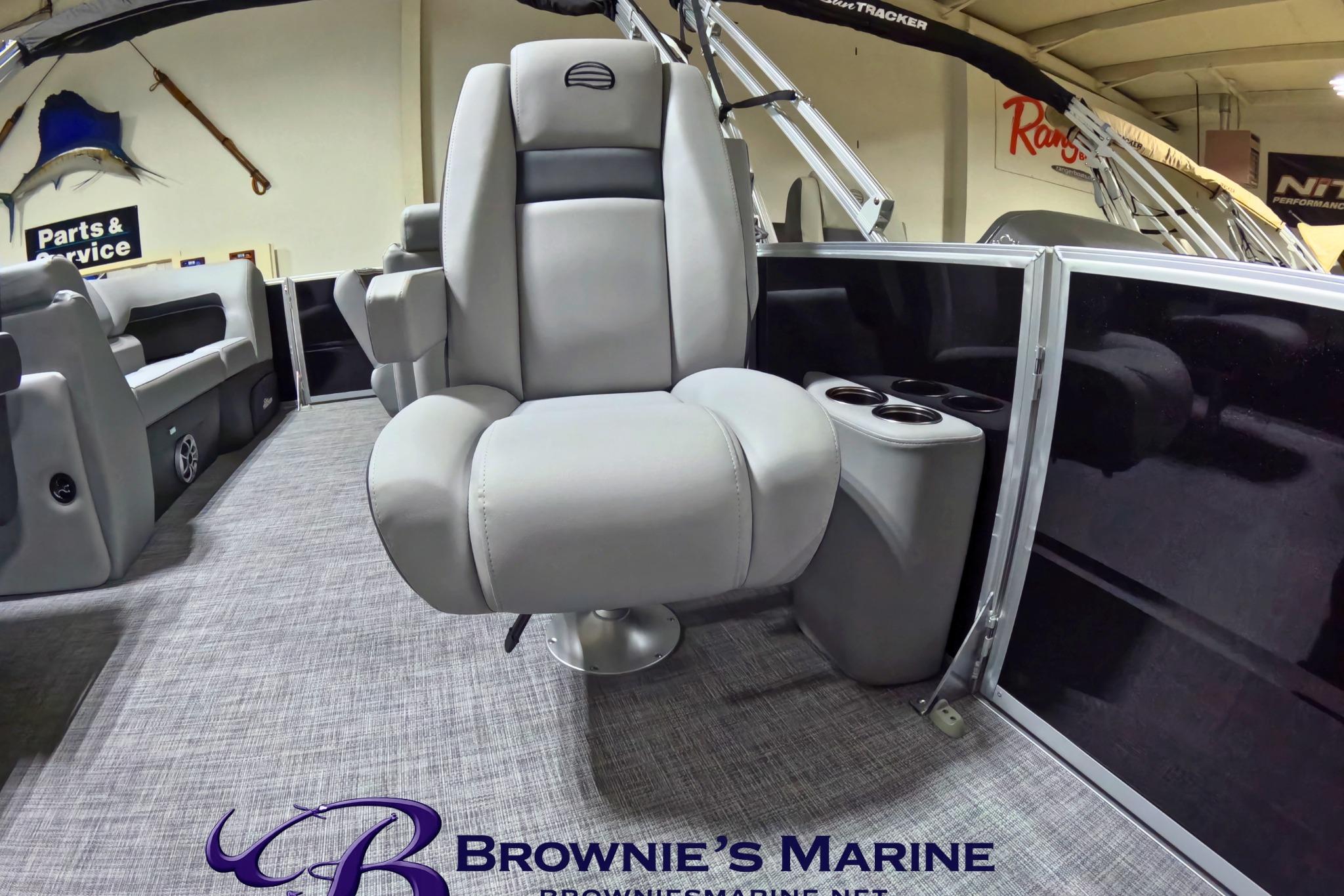 2026 Sun Tracker Party Barge 24 XP3 interior with plush seating and cup holders.
