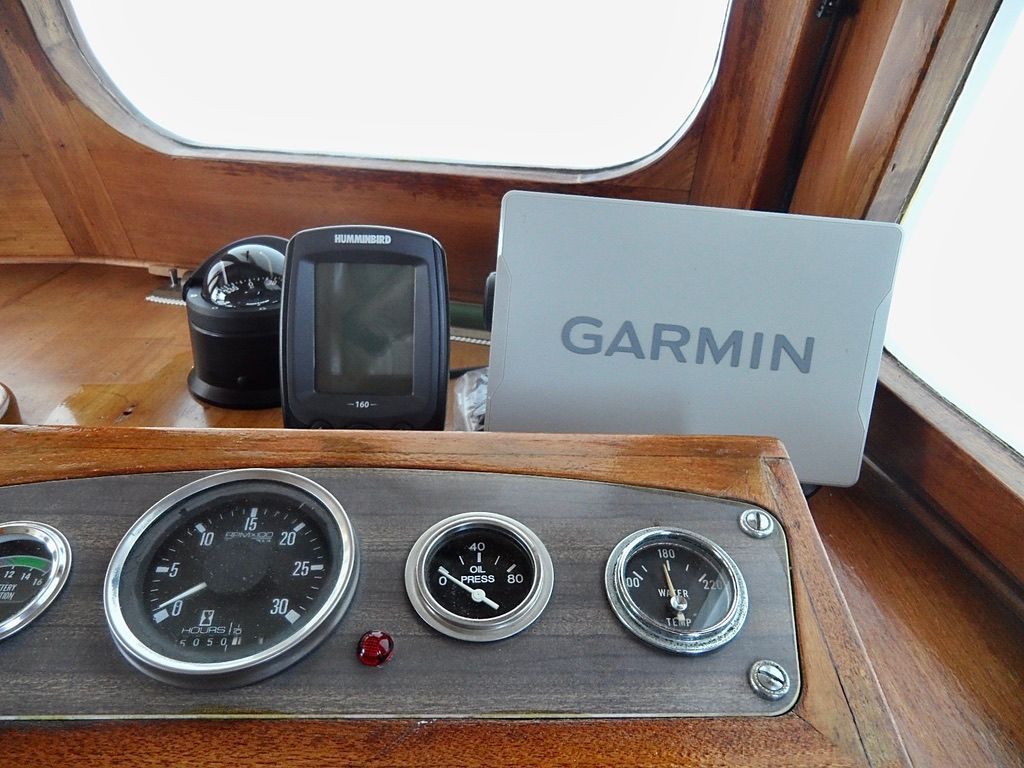 1976 CHB Trawler dashboard with Garmin and Humminbird navigation devices.