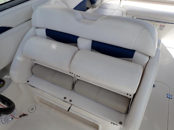 2011 Chaparral 287 SSX boat interior with white and blue cushioned seating.