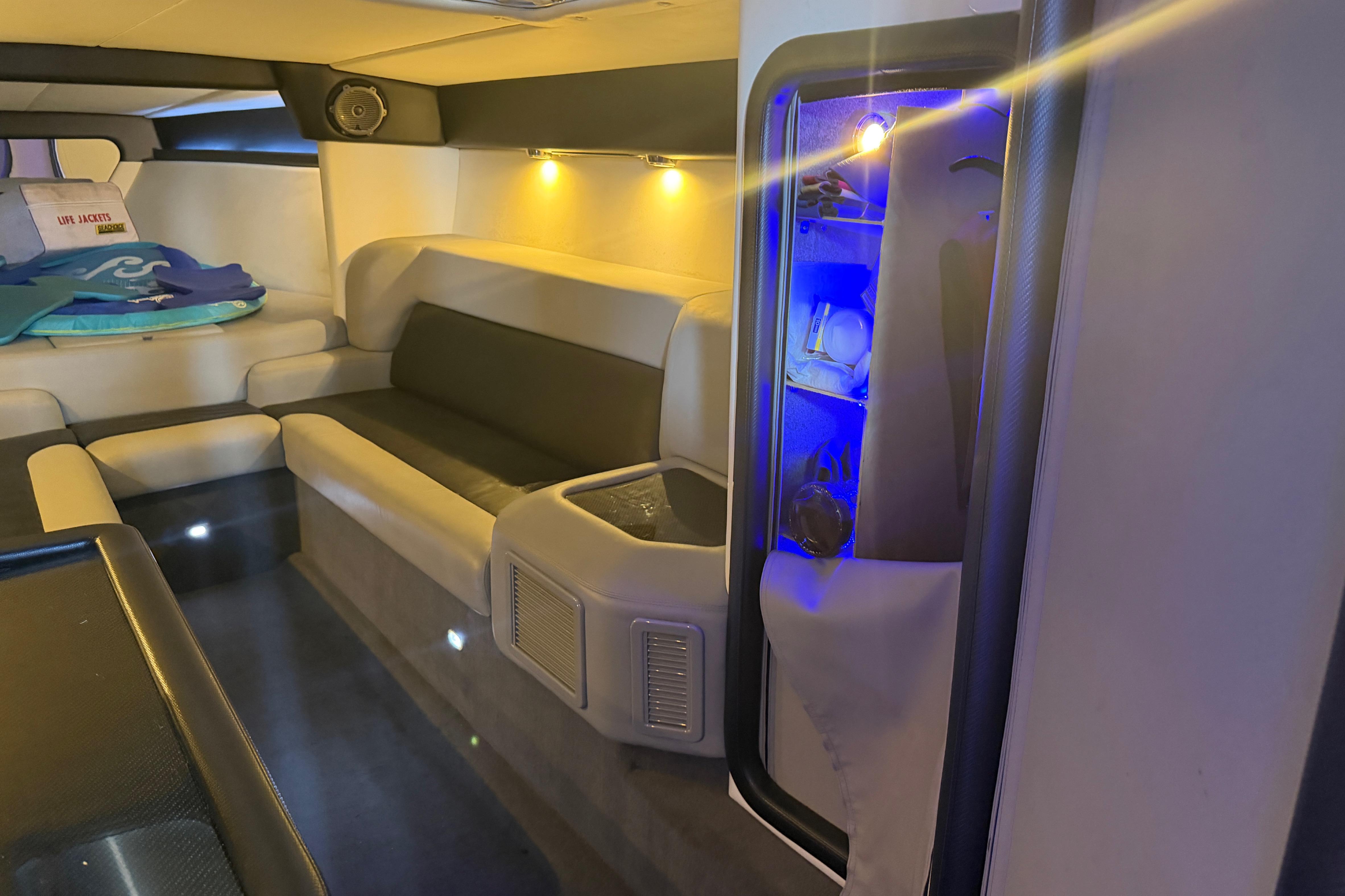 Luxurious interior of 2013 Nor-Tech 477 SPX Vee Bottom boat with ambient lighting.