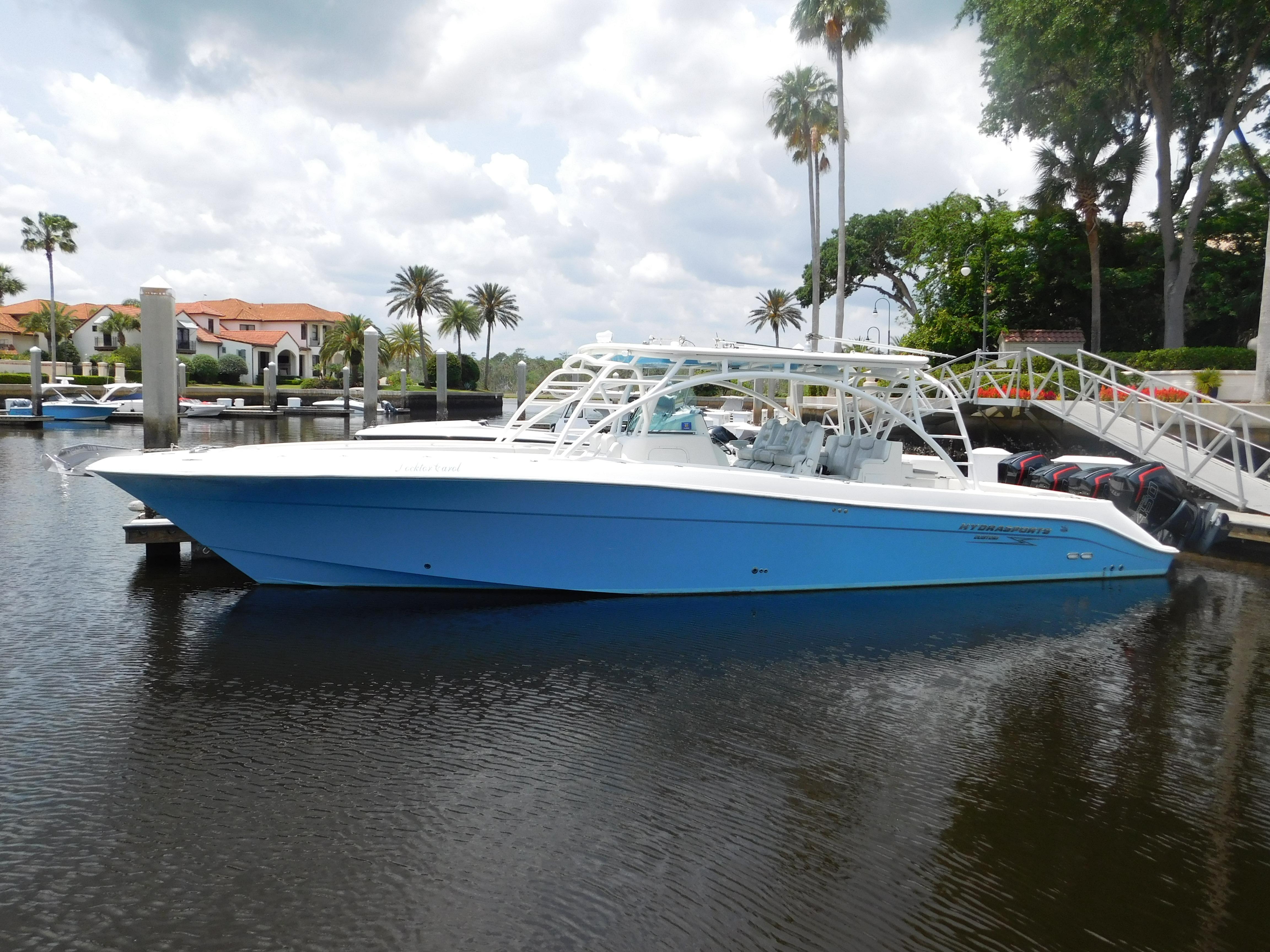 2013 Hydra-Sports 4200 Siesta boat docked in a scenic marina setting.
