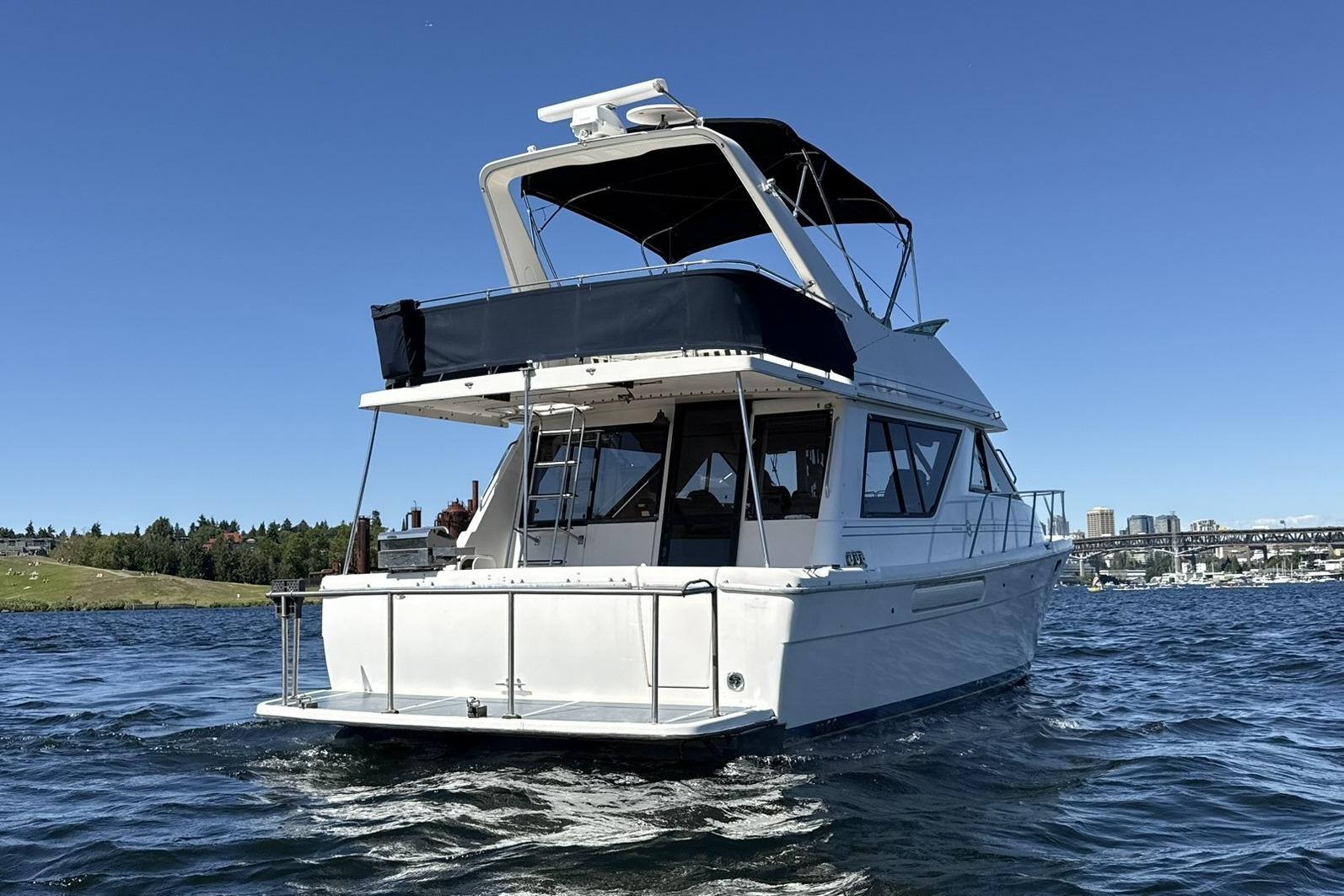 1997 Bayliner 3988 Command Bridge Motoryacht cruising on a sunny day.