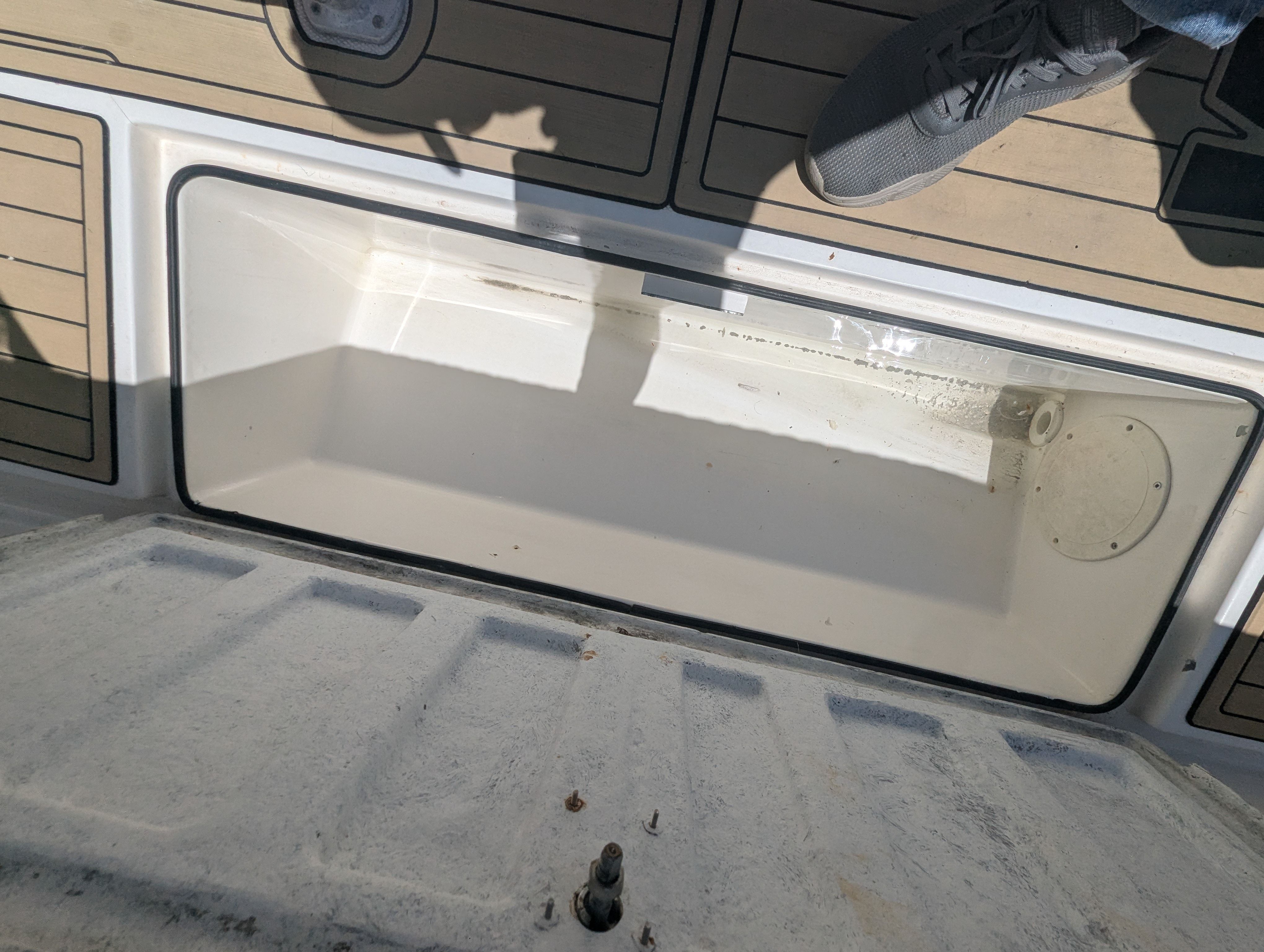 Open storage compartment on a 2005 Wellcraft 35 CCF boat.