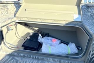 Storage compartment of 2026 Tracker Grizzly 1650 T Prairie Wings Edition boat.
