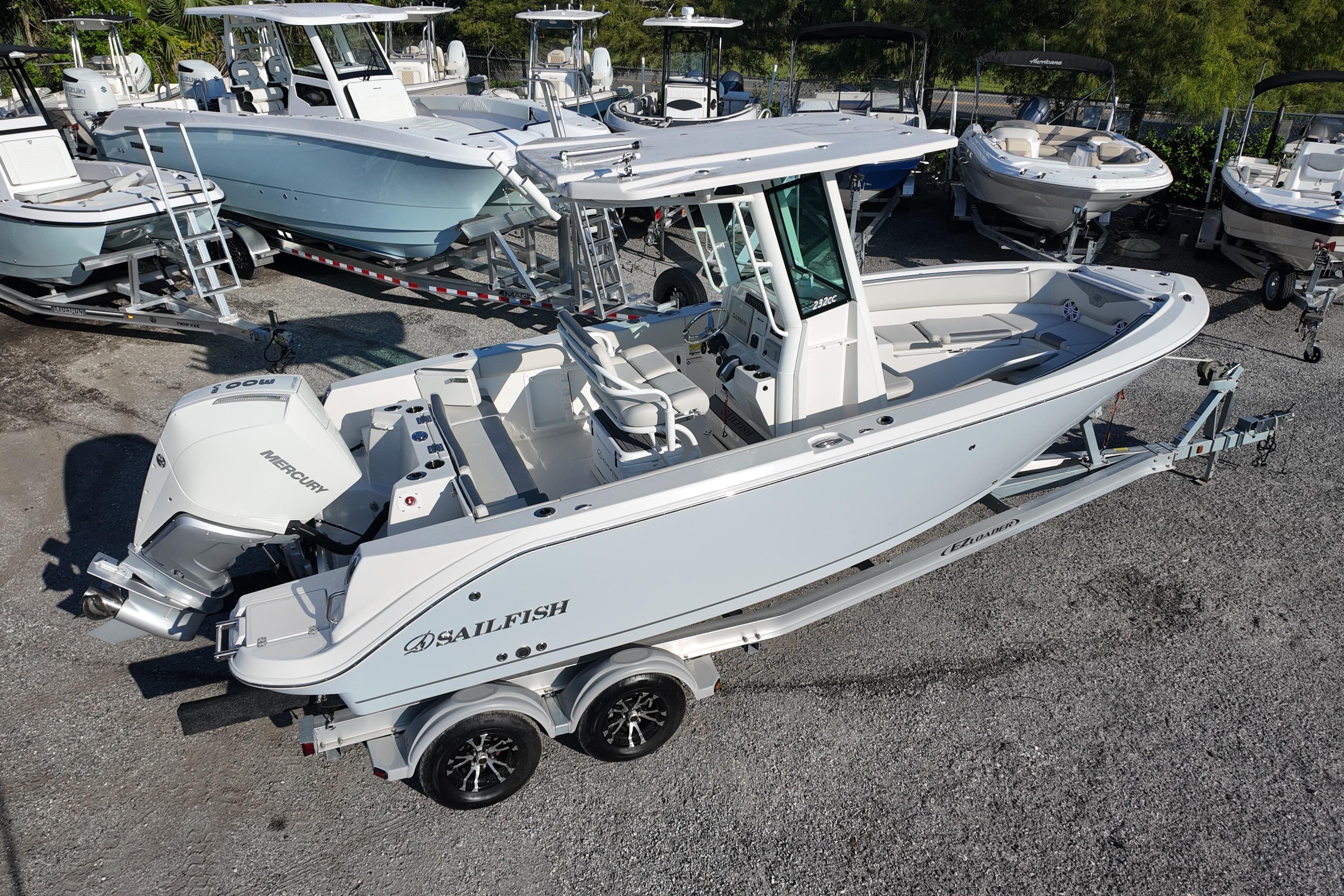 2026 Sailfish 232 CC boat on trailer, surrounded by other boats in a marina.