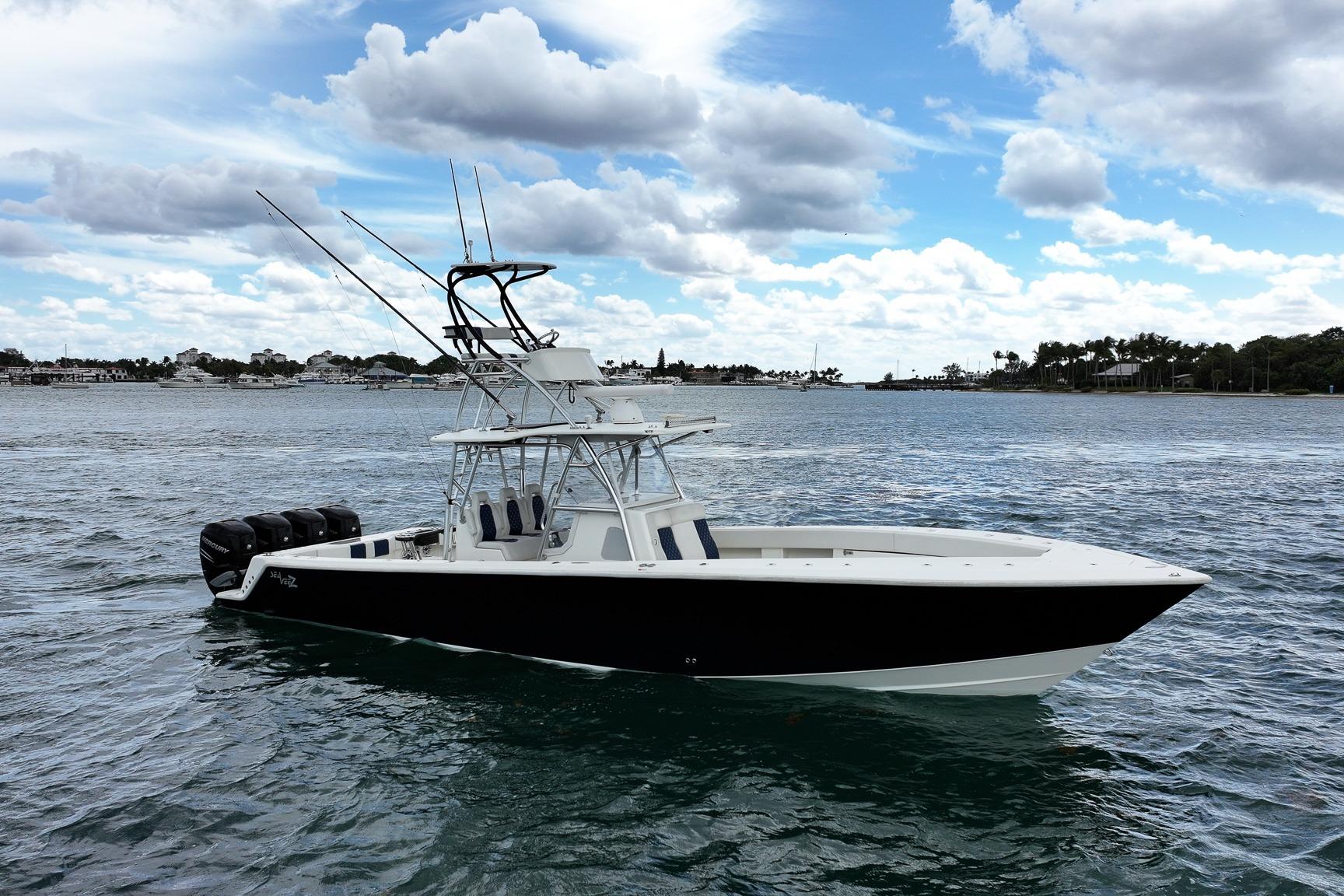 2022 SeaVee 390Z boat on water with clear sky and clouds.