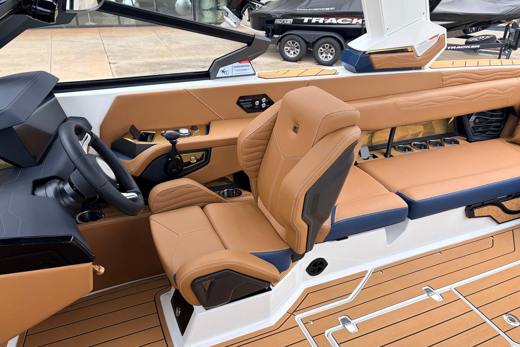 2026 Nautique Super Air Nautique G25 interior with tan leather seats and modern dashboard.