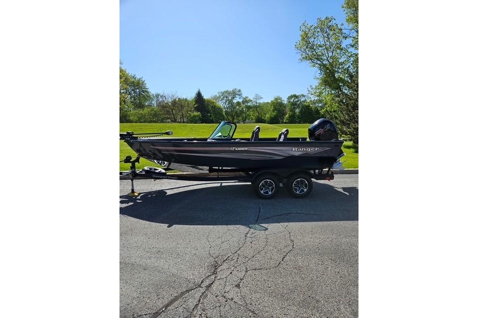 2026 Ranger VS1882SC Angler boat on trailer, parked outdoors on sunny day.