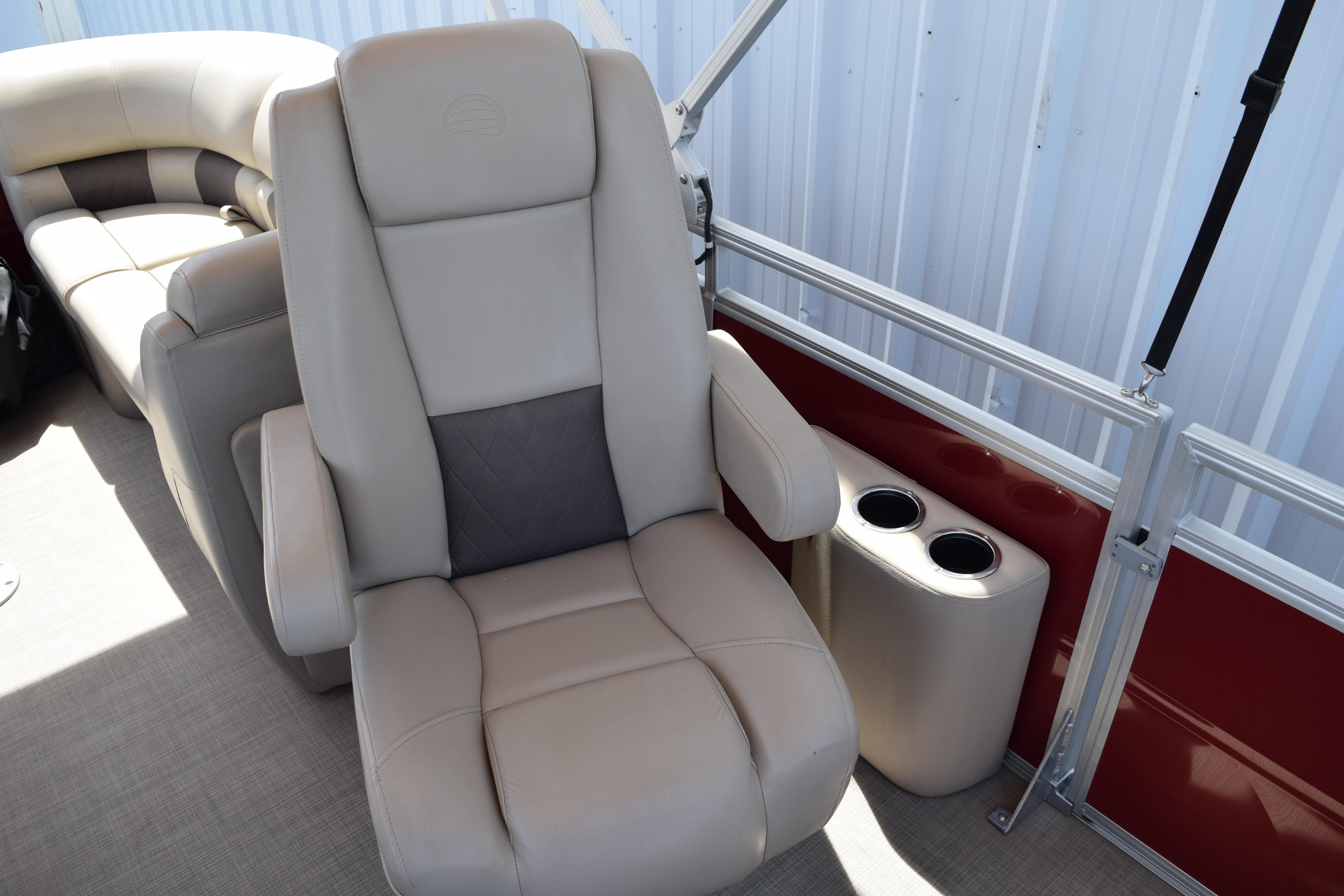 Luxurious seating on 2025 Sun Tracker Party Barge 22 XP3 with cup holders.