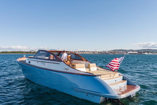 2023 Vento V40 Retro Classic Open boat cruising on a sunny day.