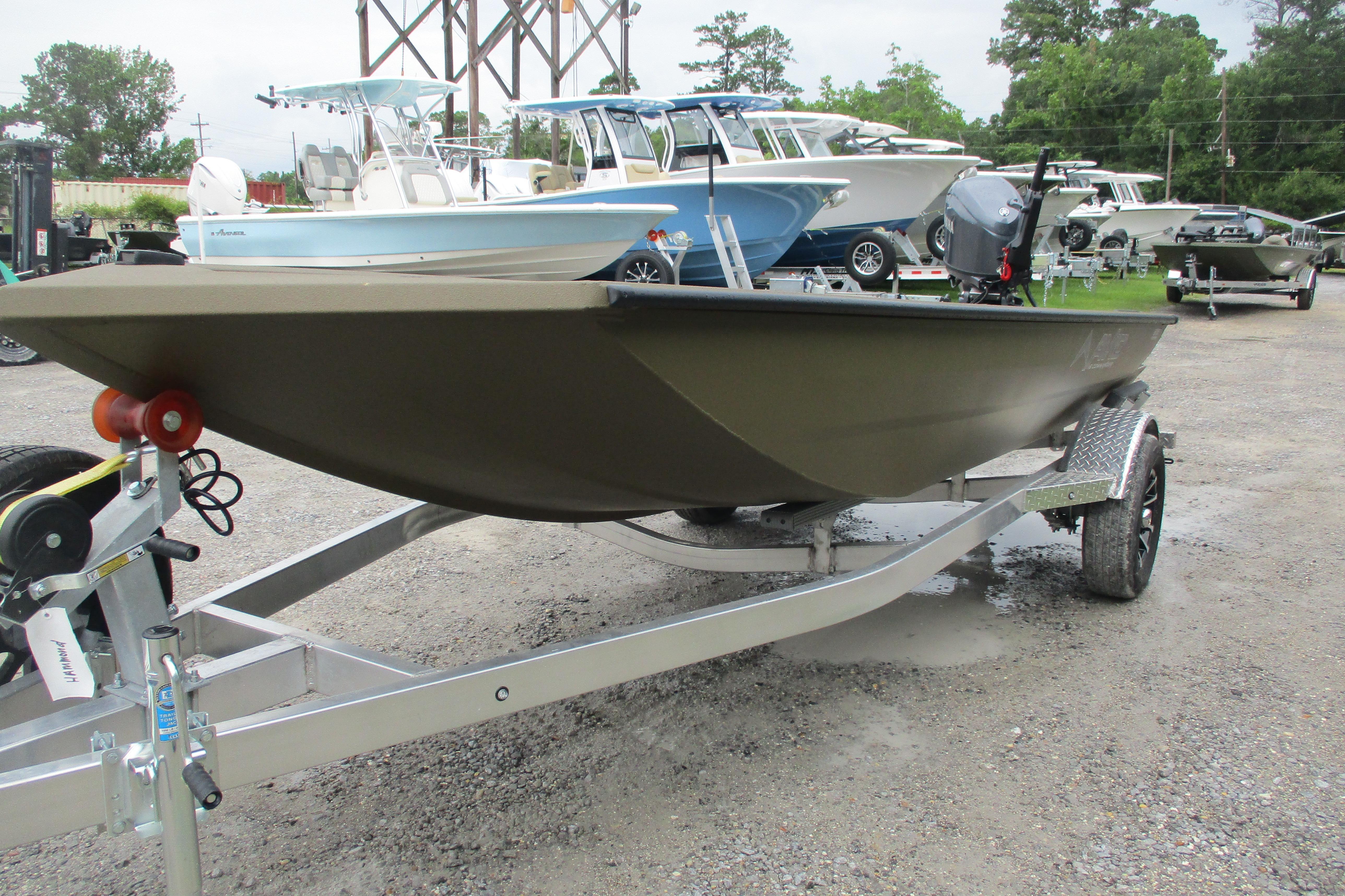 2026 Avid 16 Commander boat on trailer in outdoor showroom.
