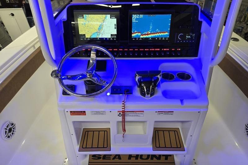 2026 Sea Hunt Ultra 275 Coffin Box boat dashboard with navigation screens and controls.