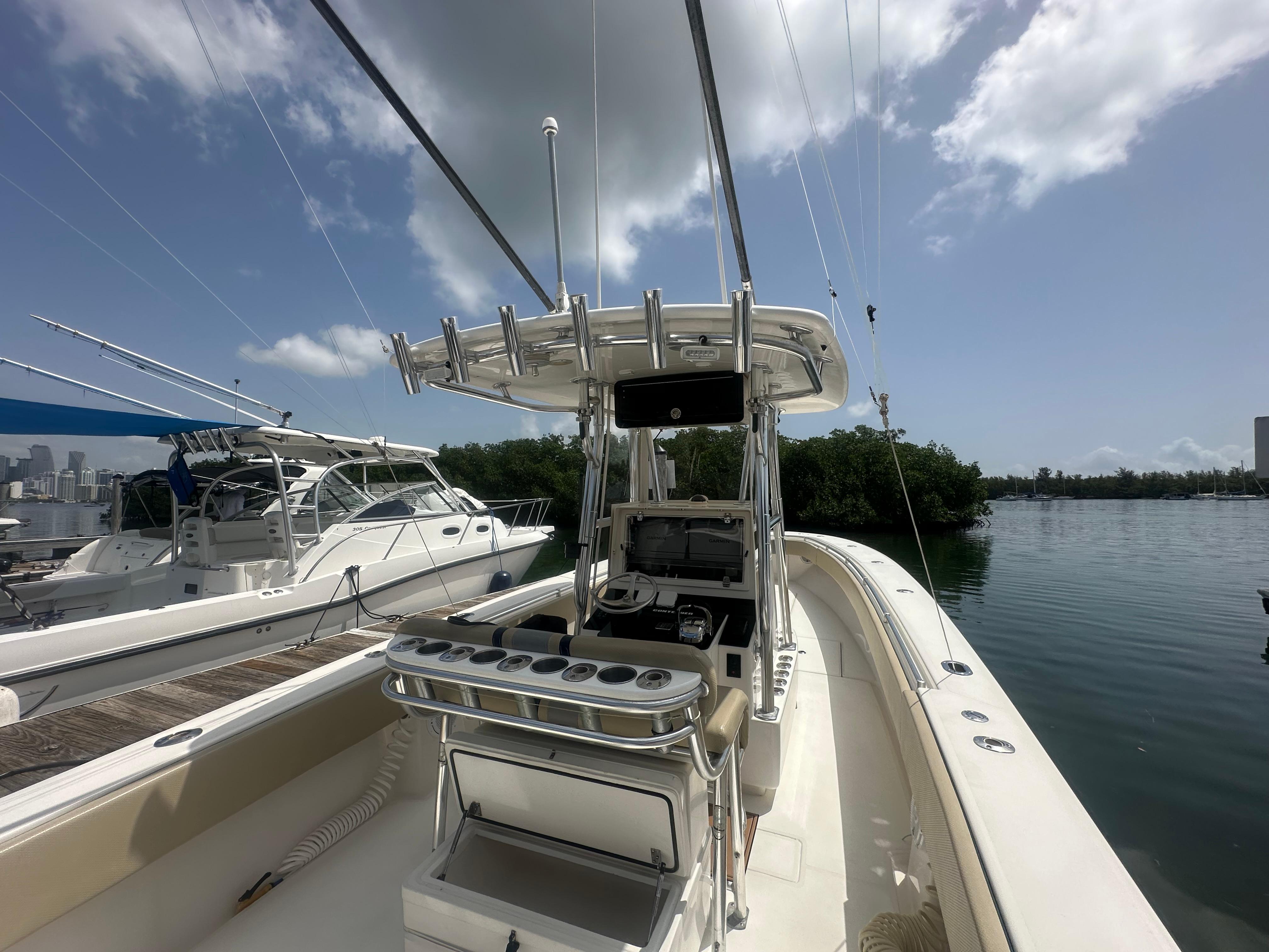 2008 Contender 36 Open boat docked, featuring a sleek design and spacious deck.