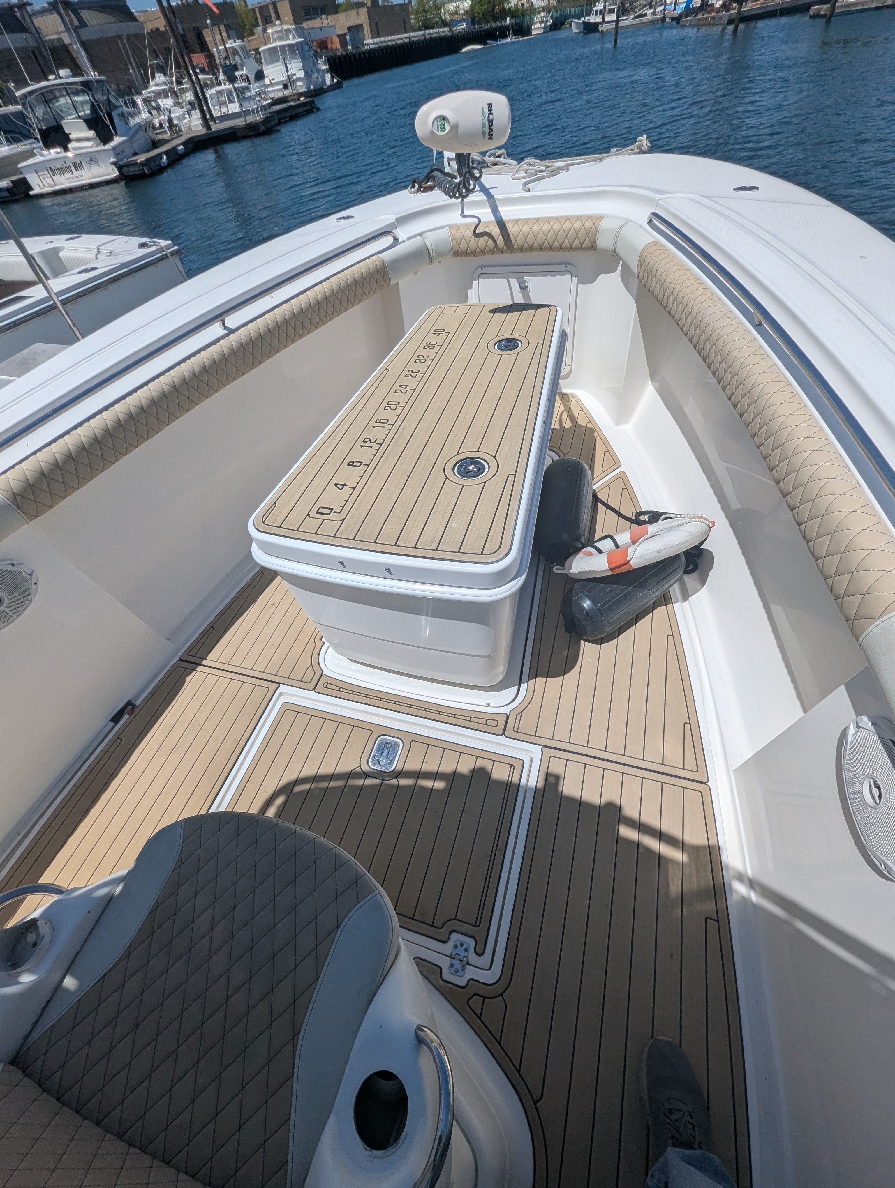 Interior of a 2005 Wellcraft 35 CCF boat with wooden flooring.