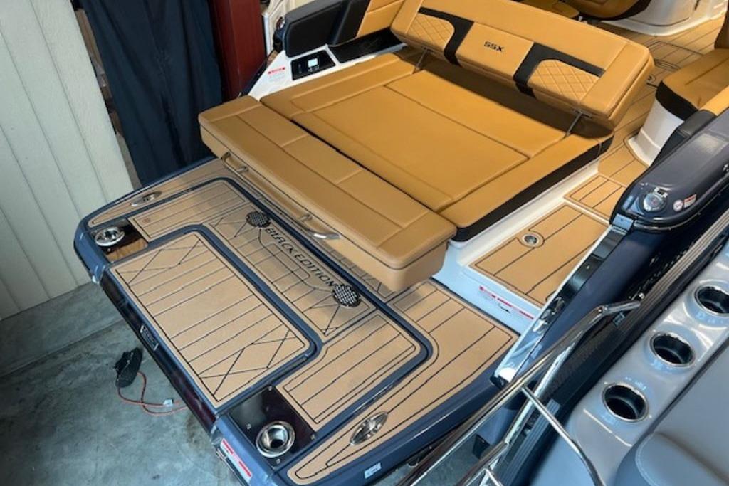 2025 Chaparral 2870 SSX boat with tan seating and sleek deck design.