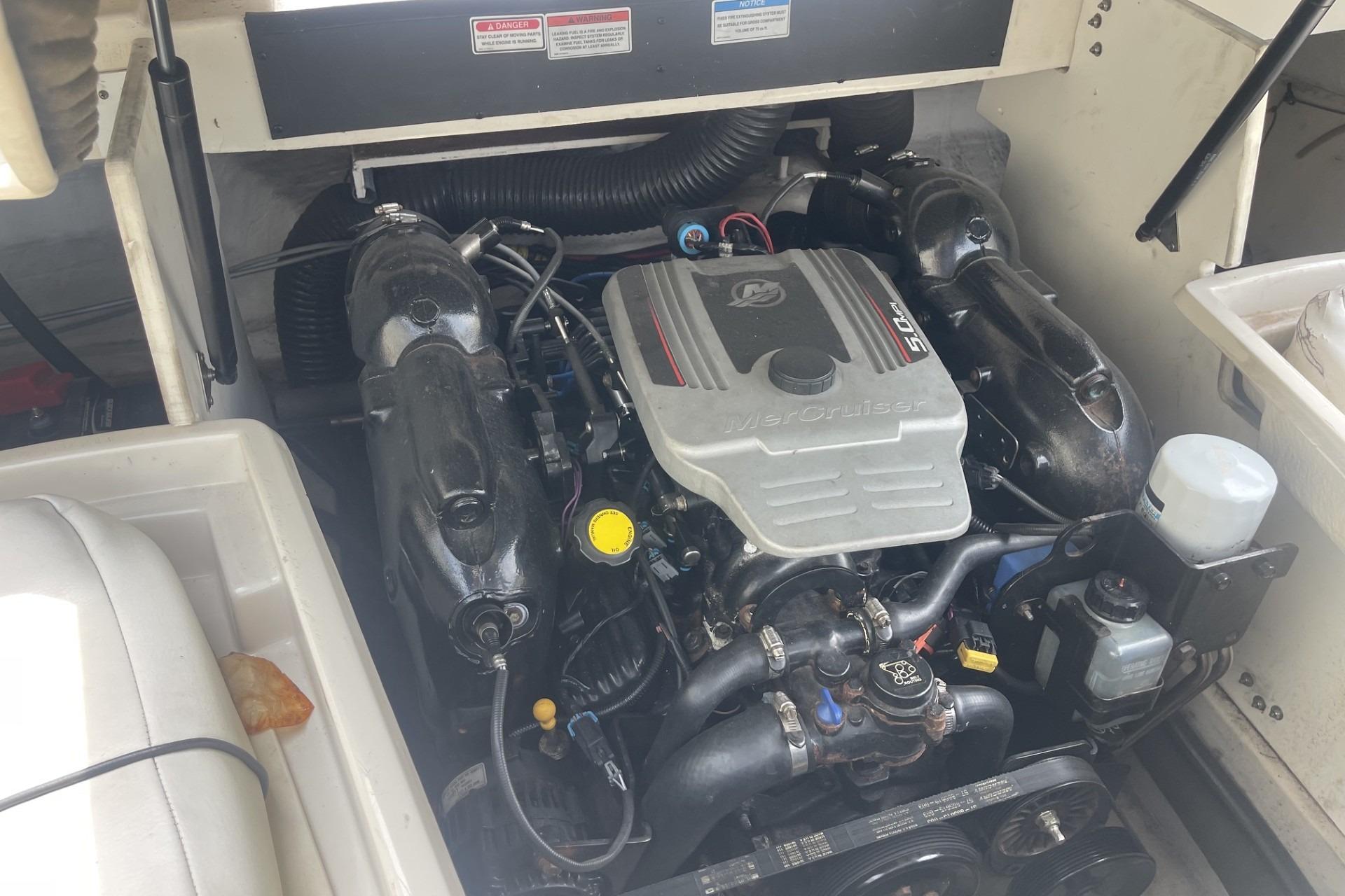 Engine compartment of a 2010 Sea Ray 230 Bow Rider Select boat.