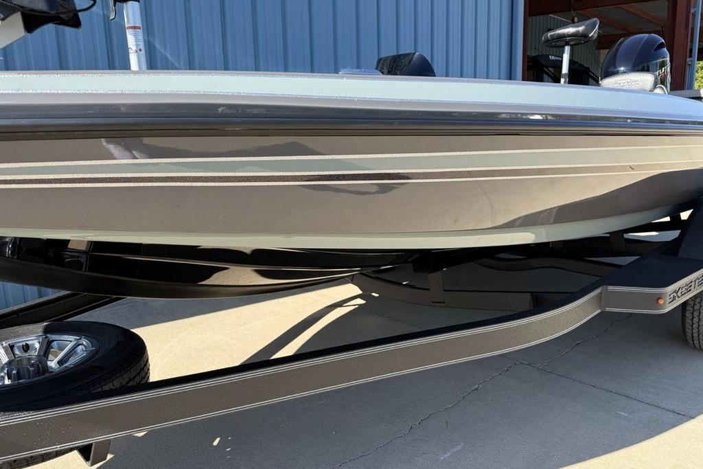 2026 Skeeter ZX150 boat on trailer, side view with sleek design.