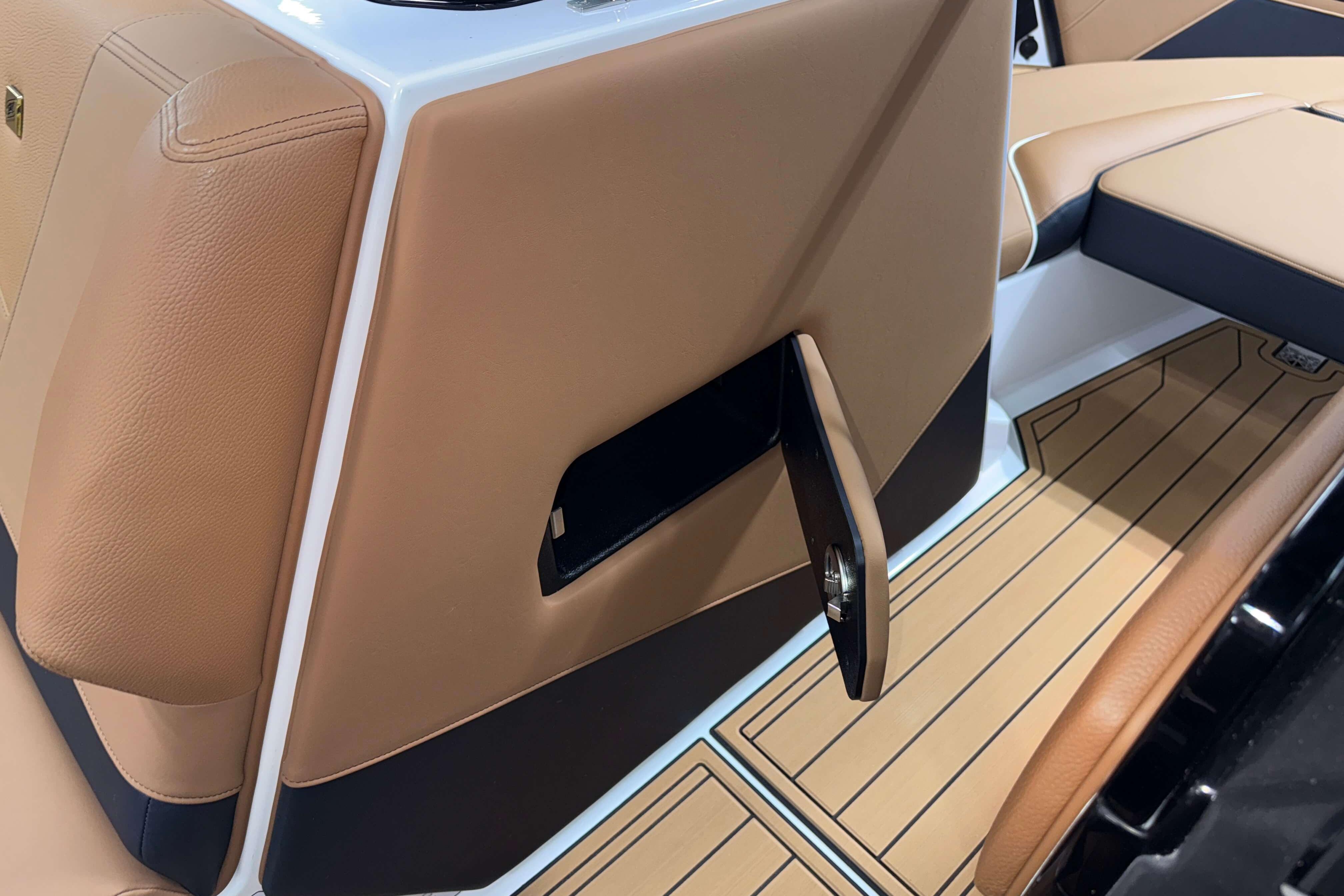 2026 Nautique Super Air Nautique S23 interior with tan leather and sleek design.