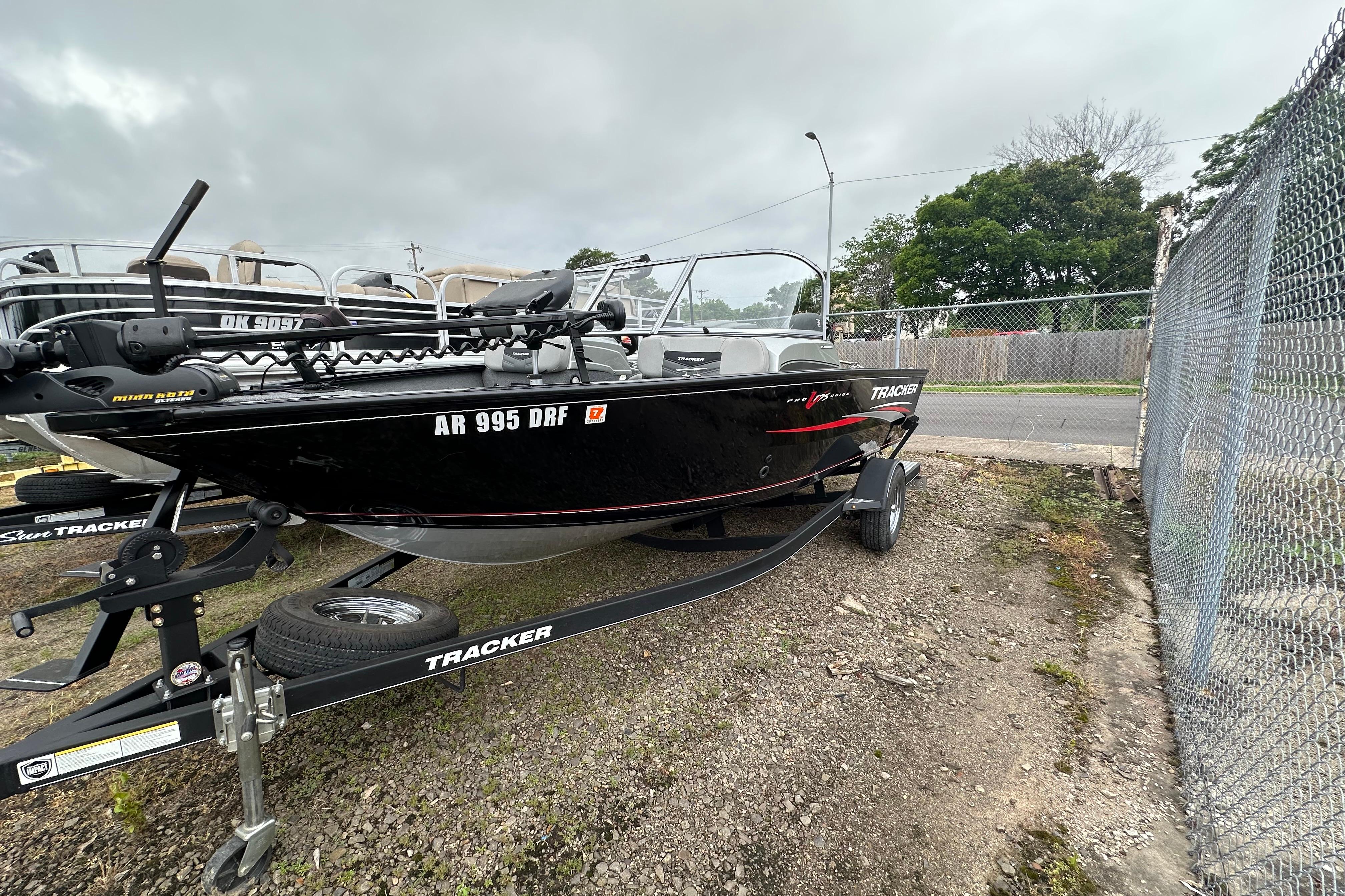 2018 Tracker Pro Guide V-175 Combo boat on trailer, parked outdoors.