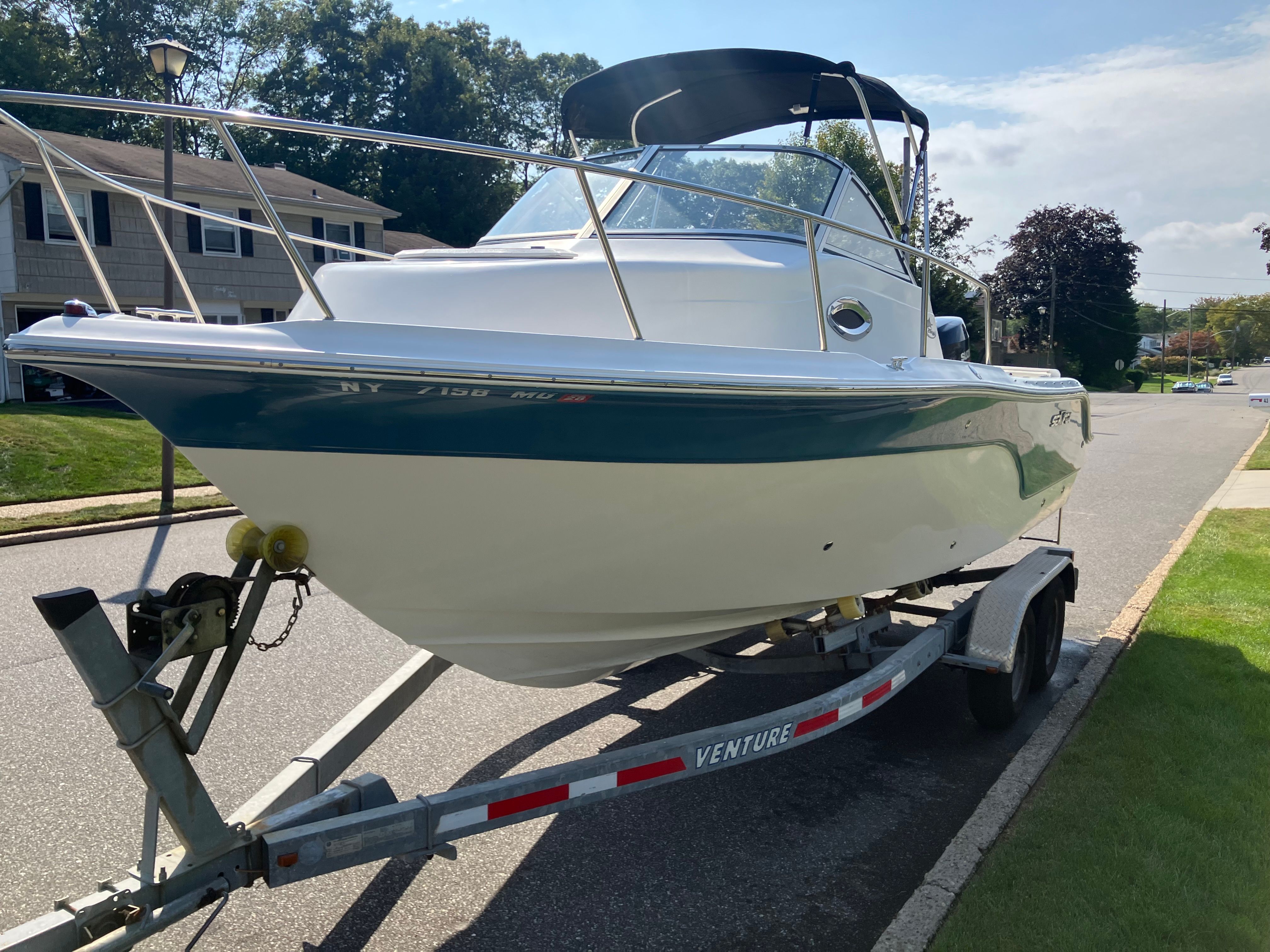 Custom 216wa pro boat from 2010 parked on a trailer.