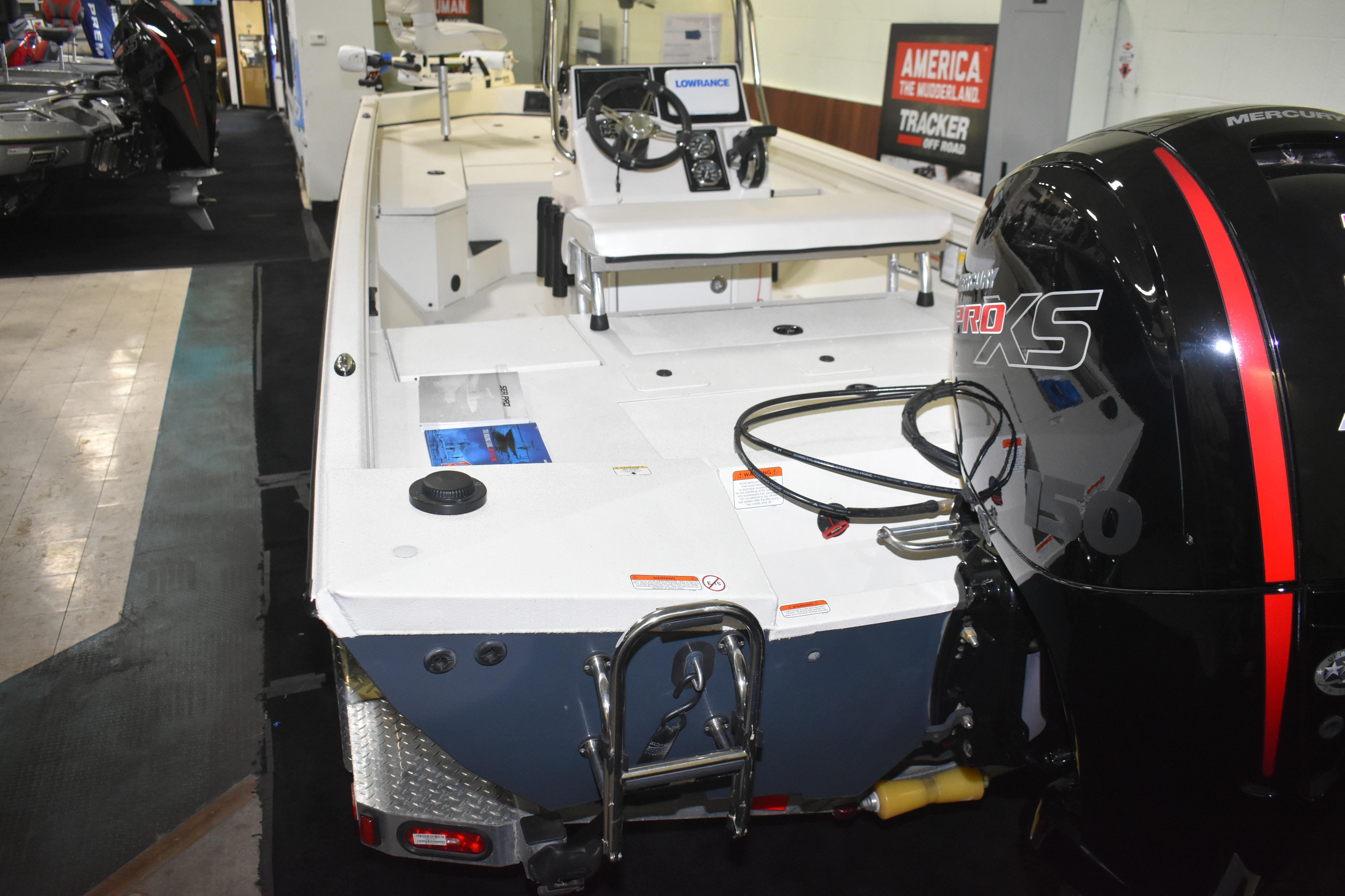 2024 Ranger RB200 boat with Mercury Pro XS engine displayed indoors.