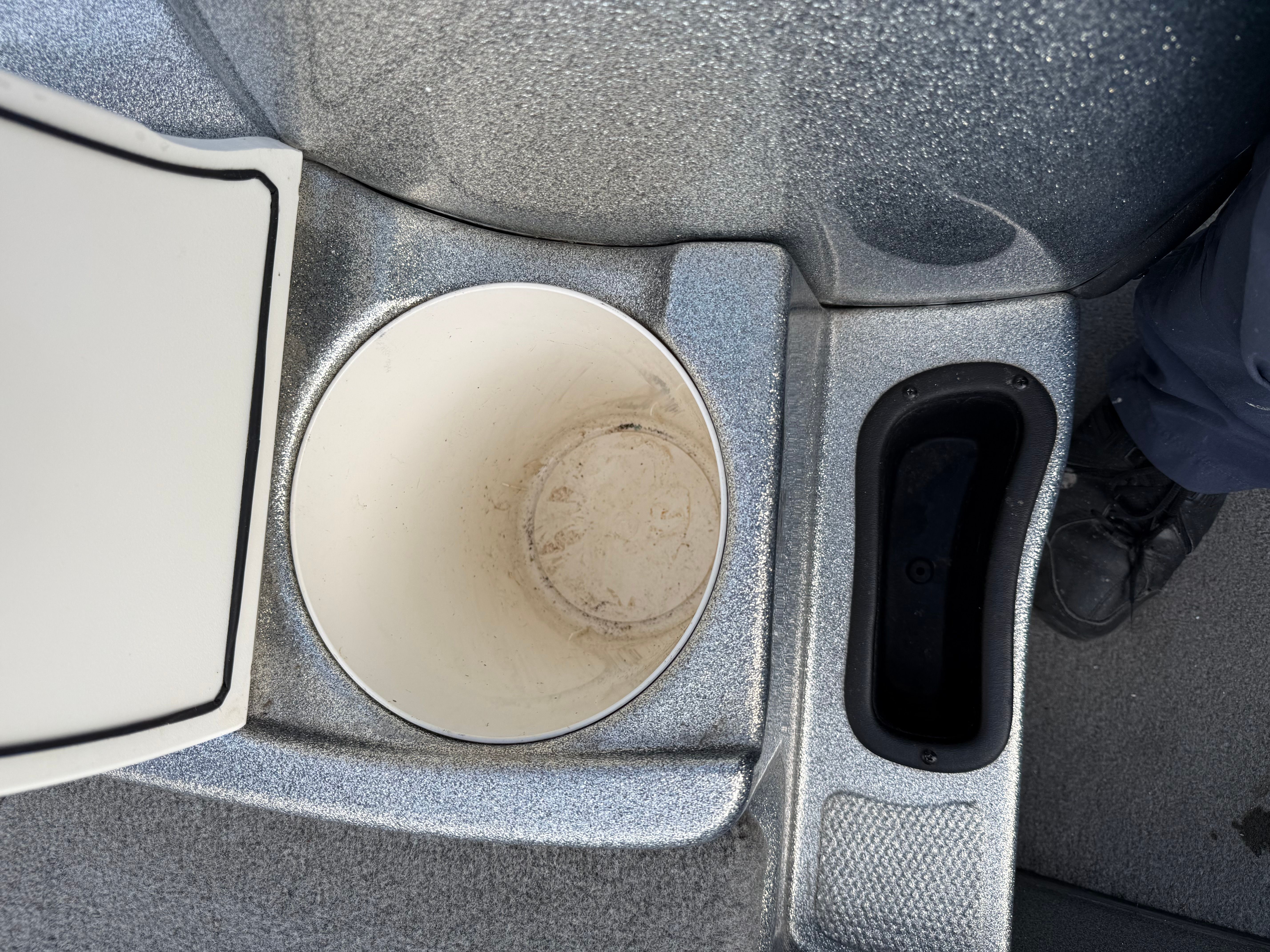 Interior of a 2004 Nitro NX 898 DC boat with storage compartment.