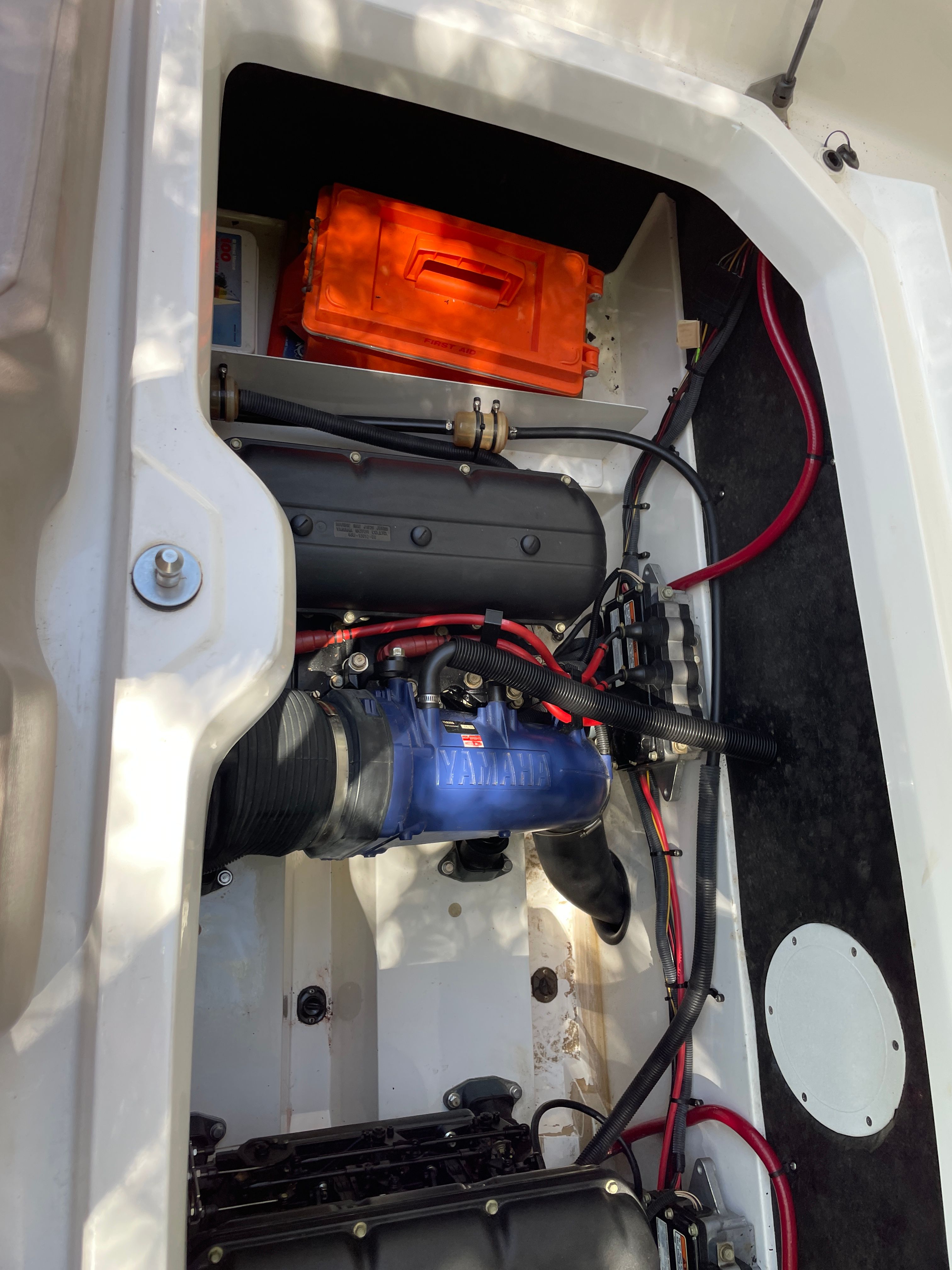 Engine compartment of a 2000 Yamaha LS2000 boat with visible components.