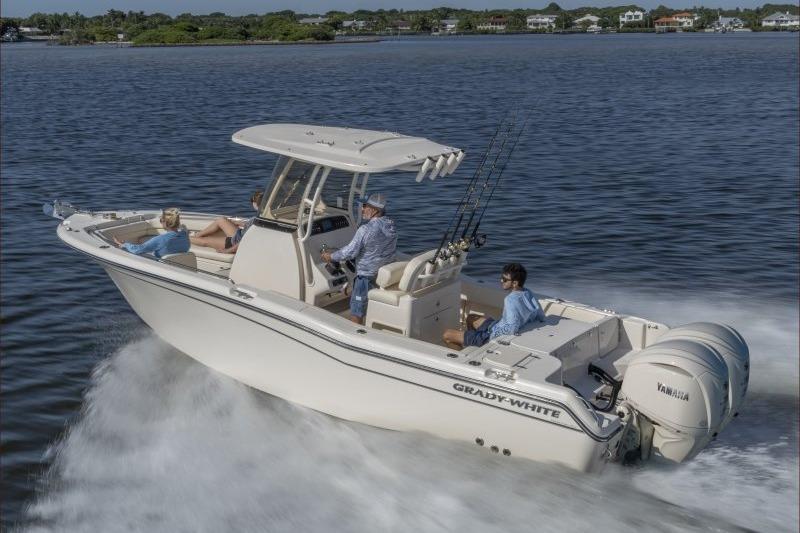 2025 Grady-White Fisherman 257 boat cruising on a calm lake with passengers.