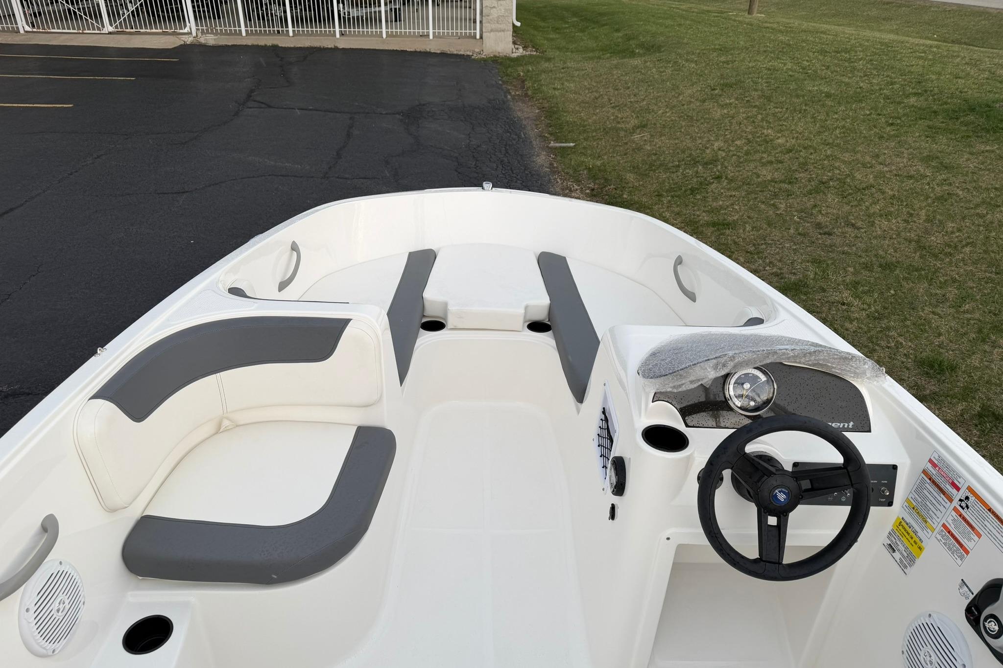 2026 Bayliner Element E16 boat interior with gray seating and steering wheel.