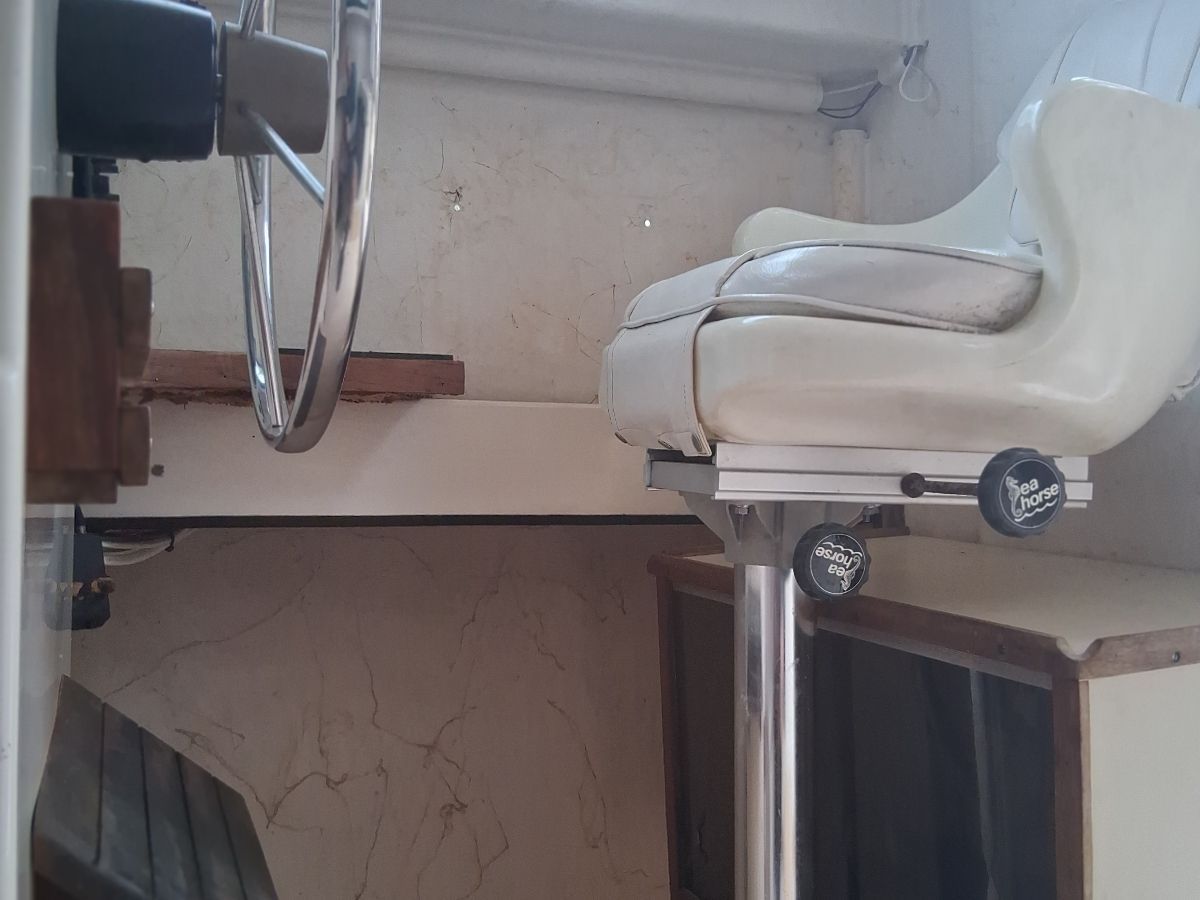 Interior of a 1987 Parker Sou'wester boat with steering wheel and seat.