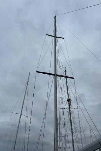 1983 O'Day 39 sailboat mast against cloudy sky.