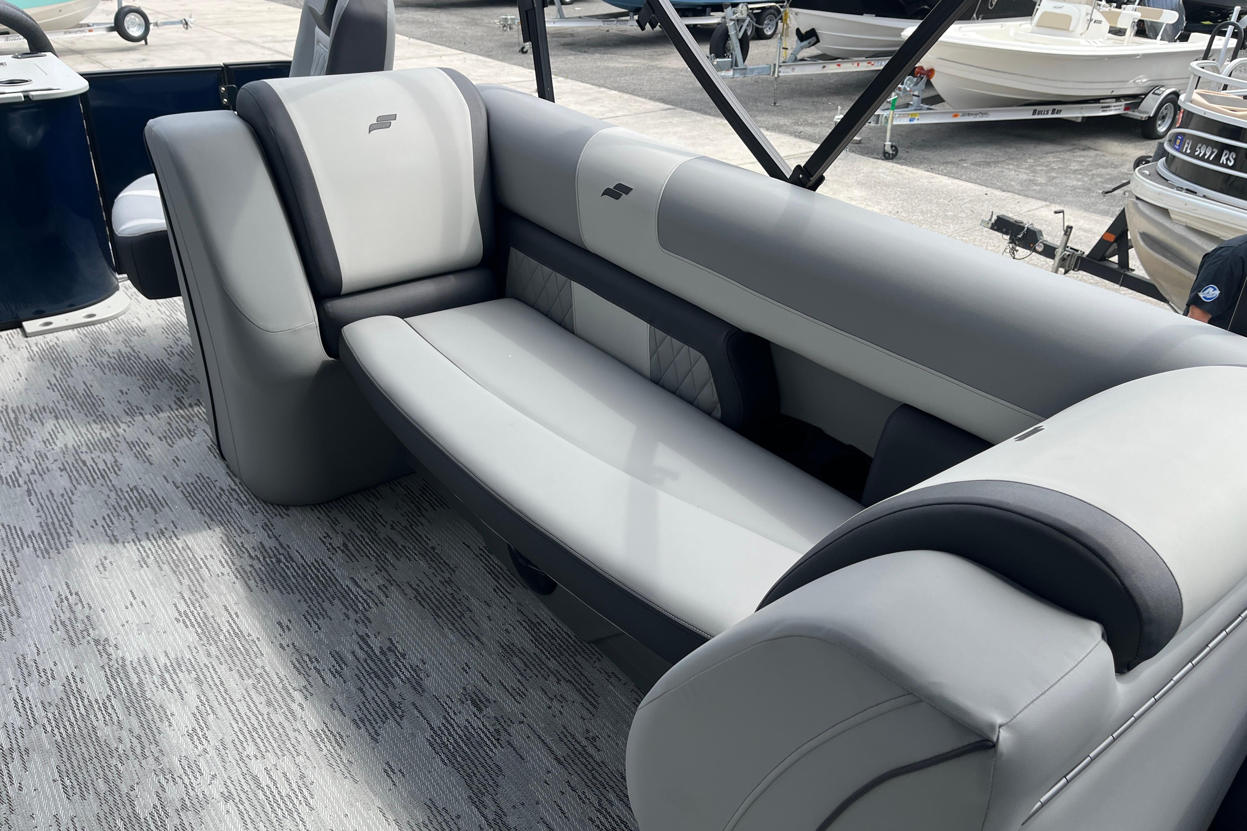 Luxurious seating on 2026 Starcraft EXS 3 FD boat, featuring sleek gray upholstery.