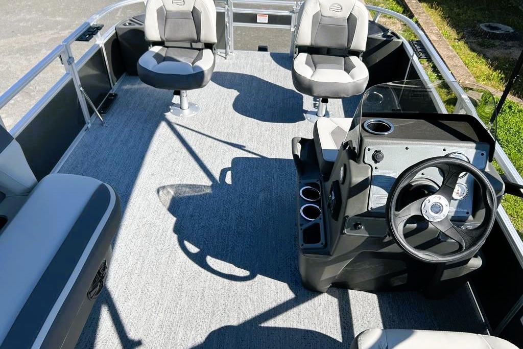 2026 Sun Tracker Bass Buggy 18 DLX interior with steering wheel and seating.