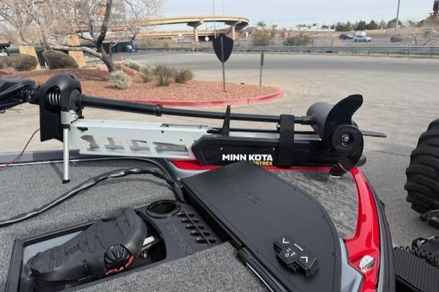 2026 Nitro Z21 XL boat with Minn Kota Ultrex trolling motor in a parking lot.