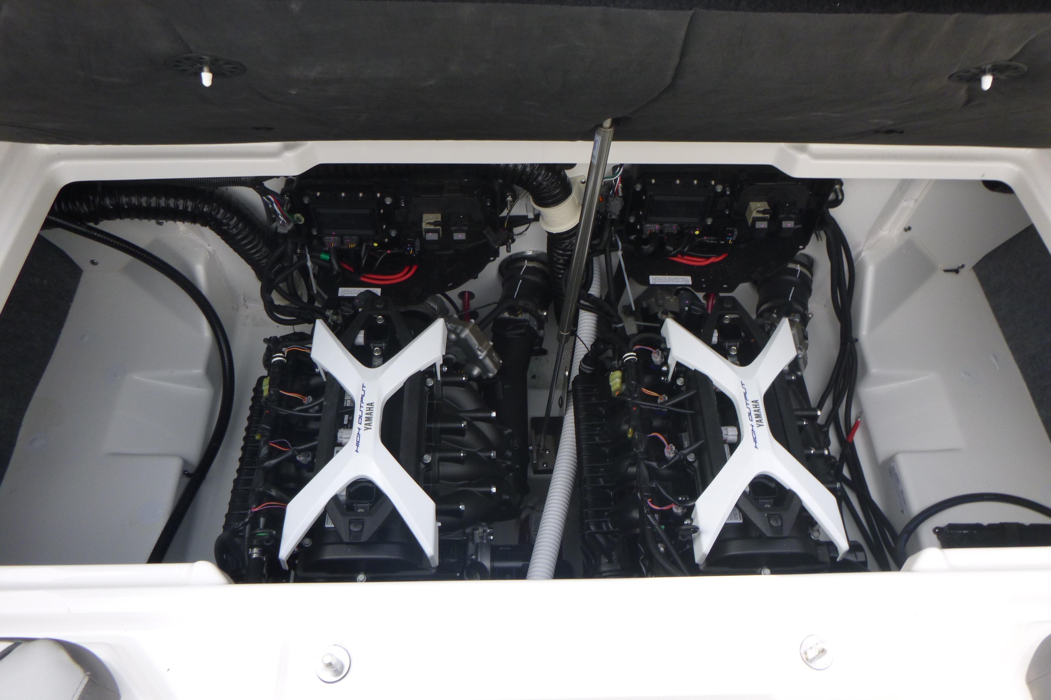 2026 Yamaha AR250 boat engine compartment with dual engines and wiring.