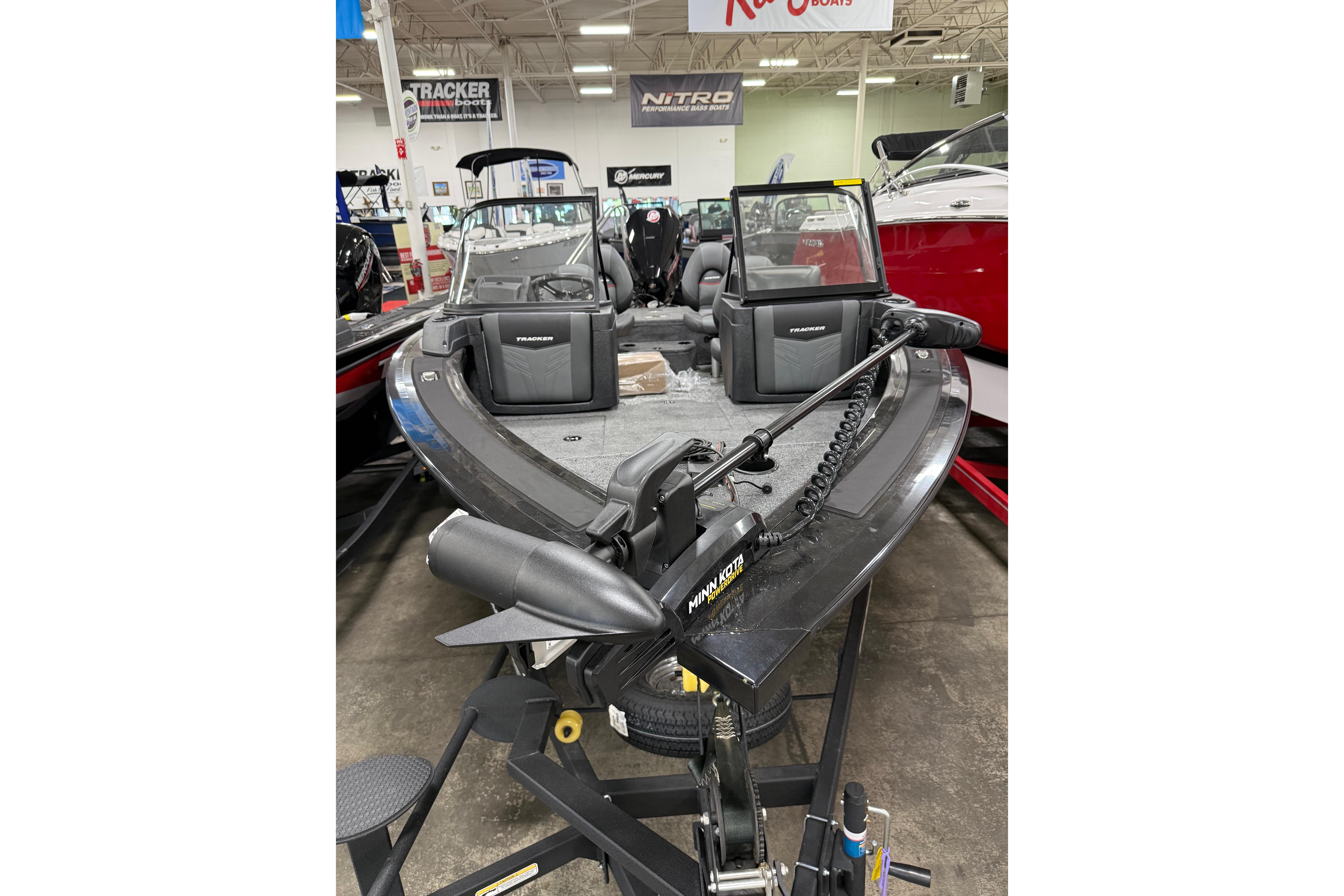 2026 Tracker Targa V-19 WT boat displayed indoors with Minn Kota trolling motor.